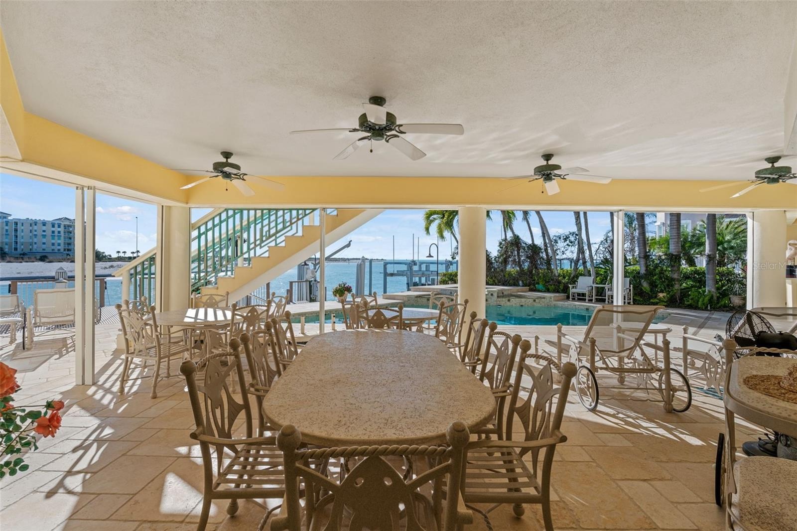 Large Covered Lanai has Hurricane Panels to protect outdoor furniture.