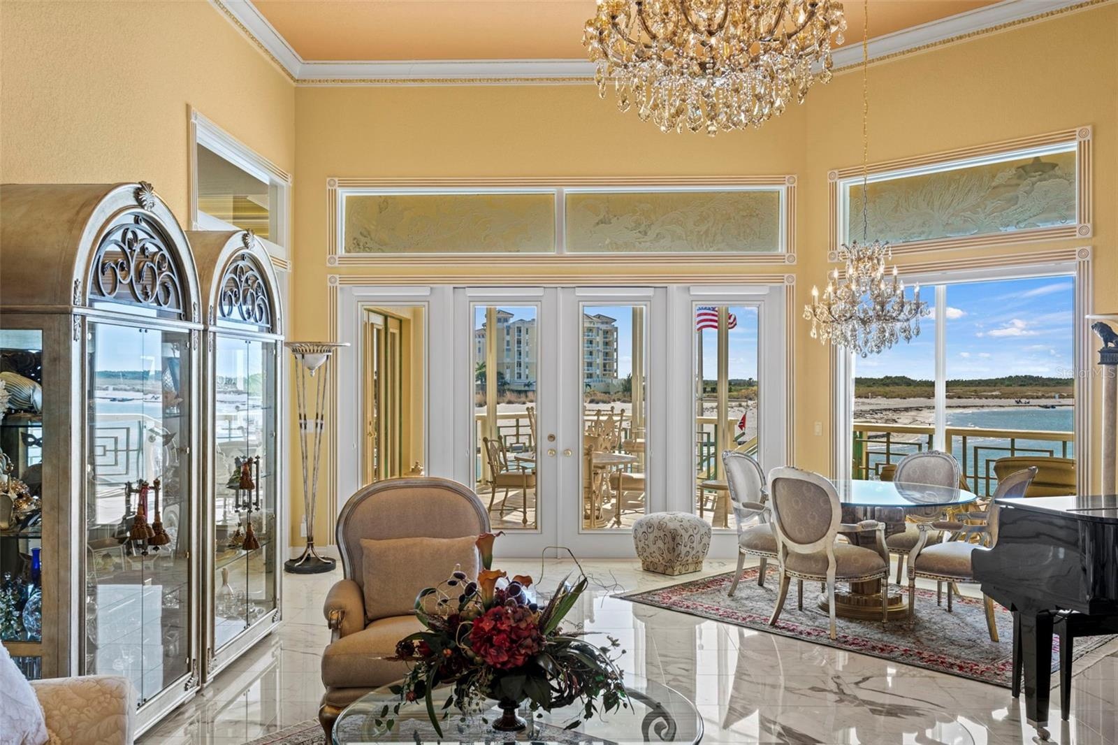 Formal Living Room with Marble Floors and French Doors to the Upper Level Lanai