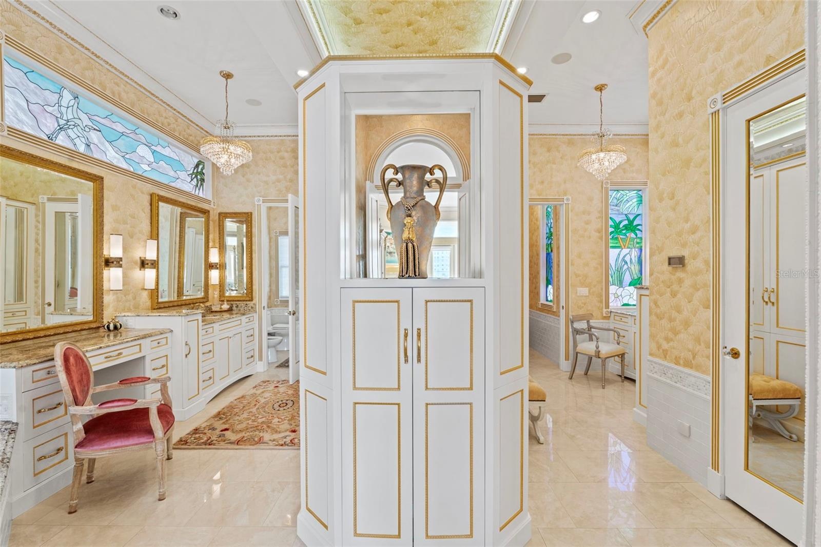 Primary Ensuite Bath has separate Vanities, Water Closets and Wardrobes.