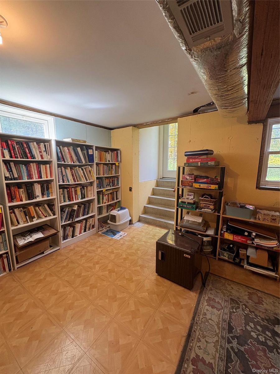 Large high ceiling basement with outside entrance
