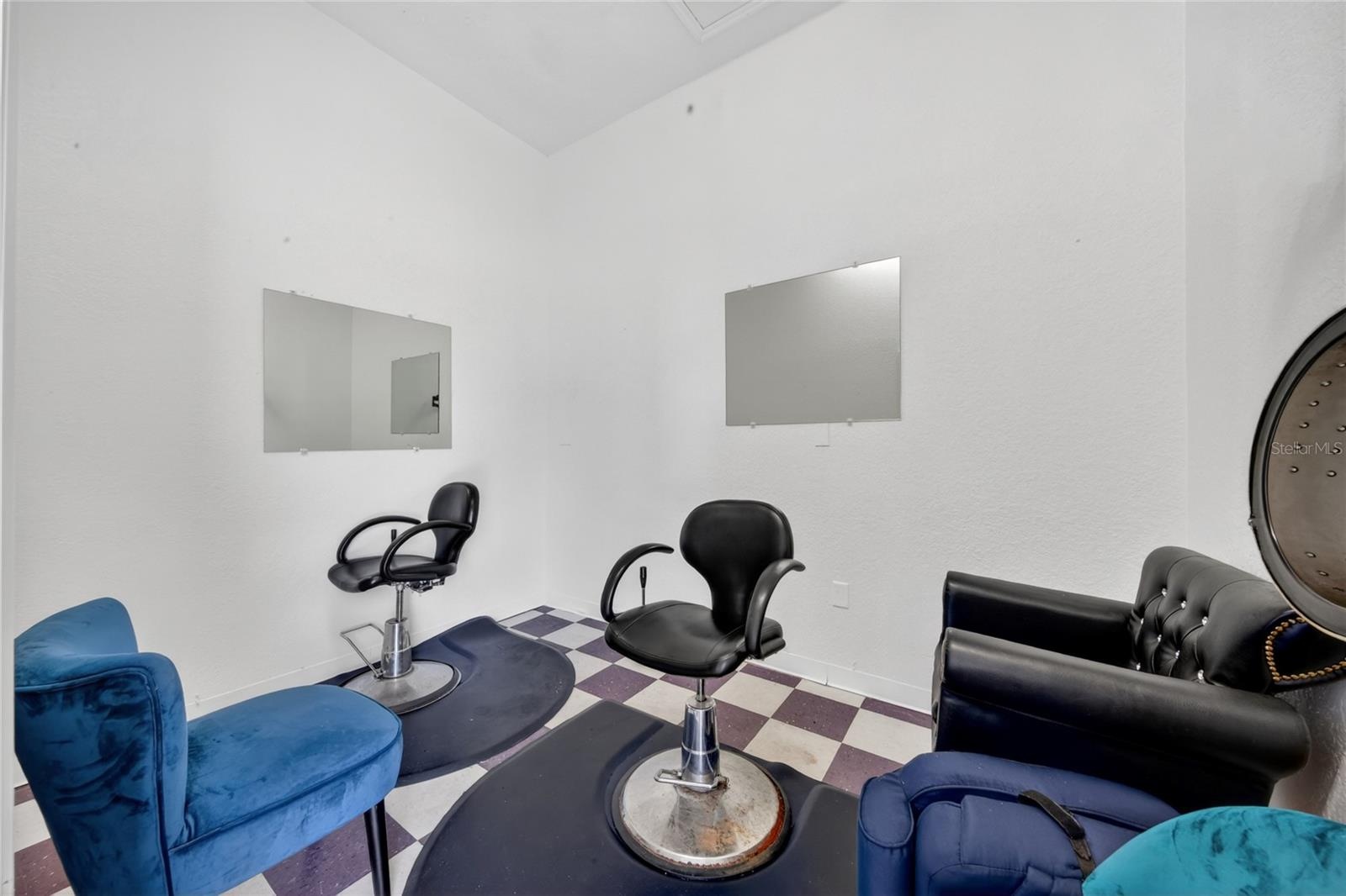 Room with two barber chairs