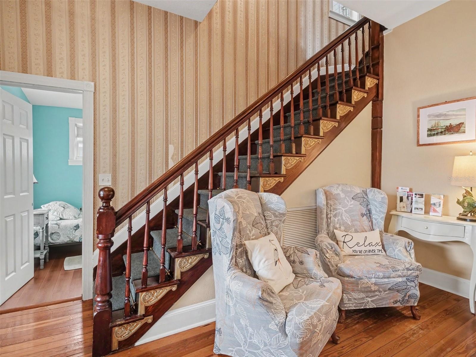 Hallway under stairs or seating area