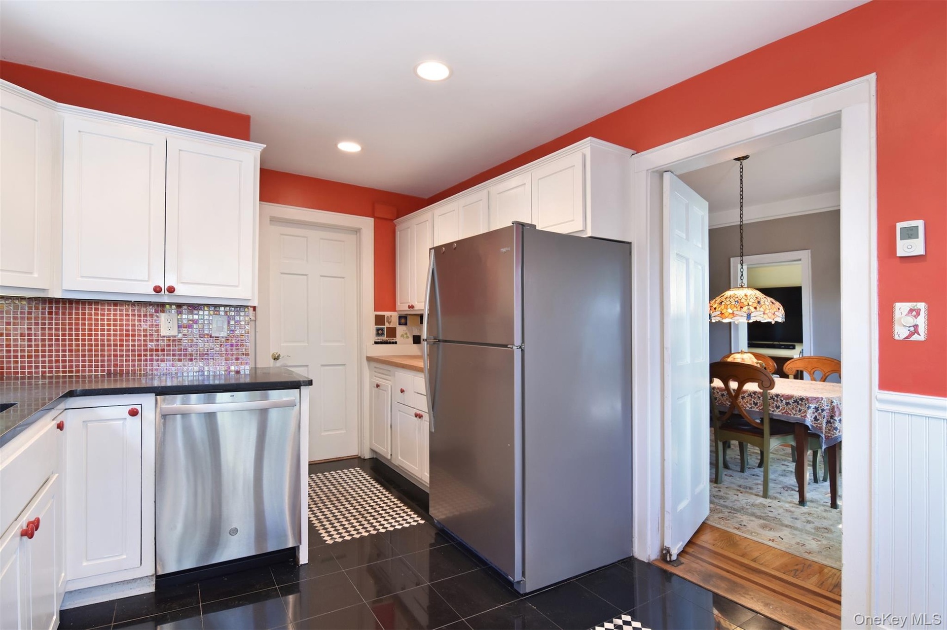 Showing refrigerator and dishwasher