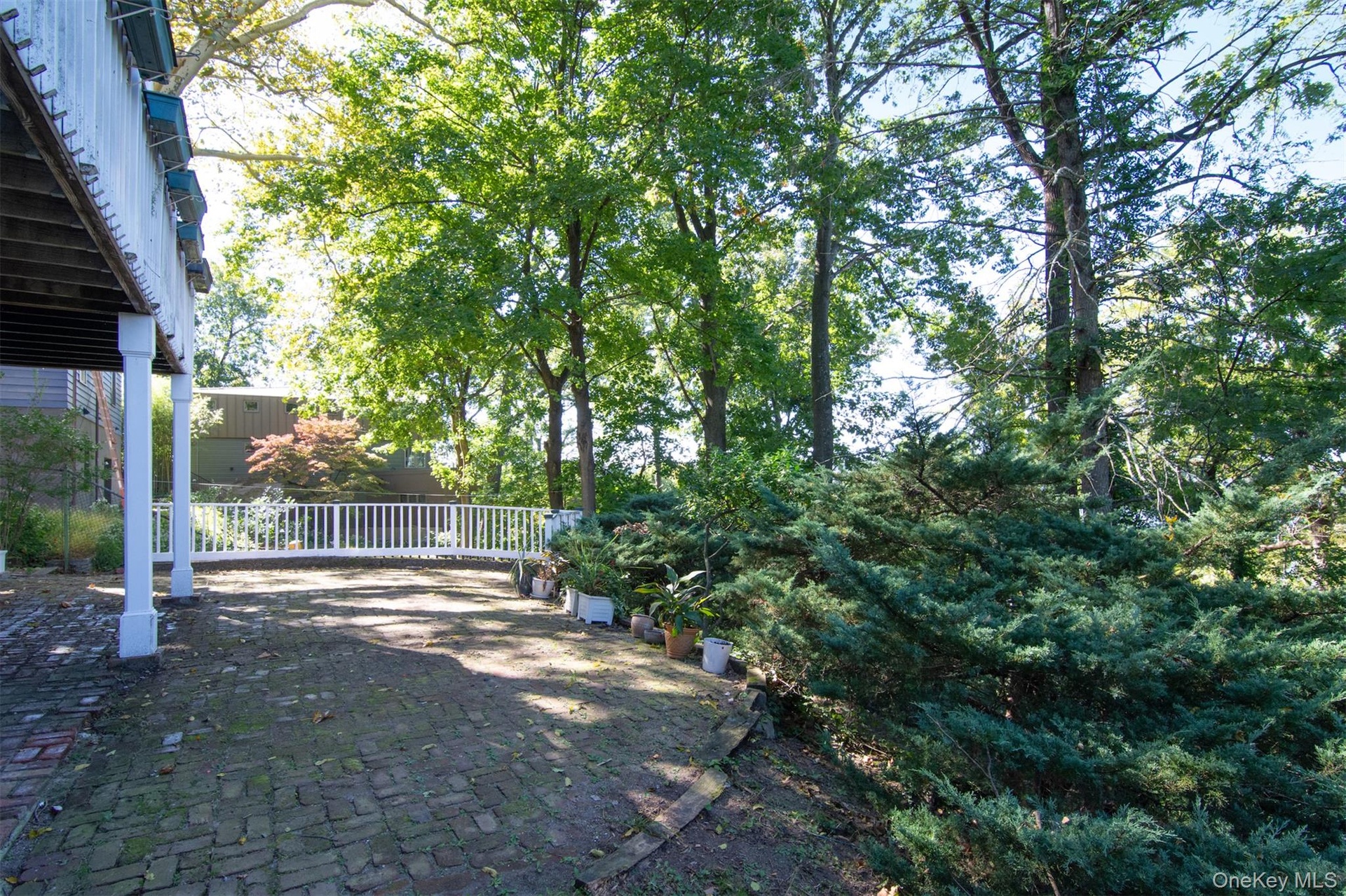 Brick patio in backyard.