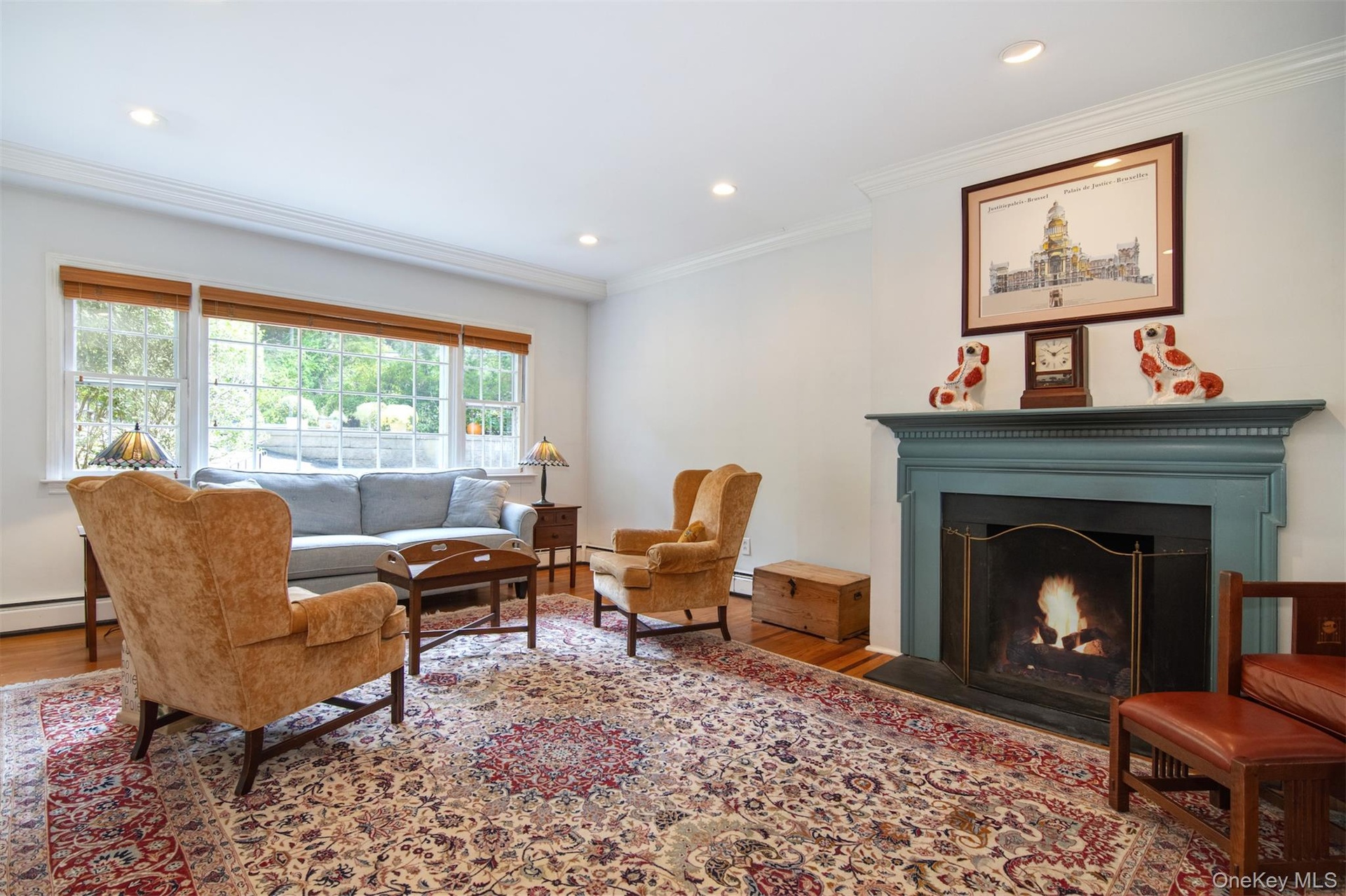 Large living room with wood-burning fireplace.