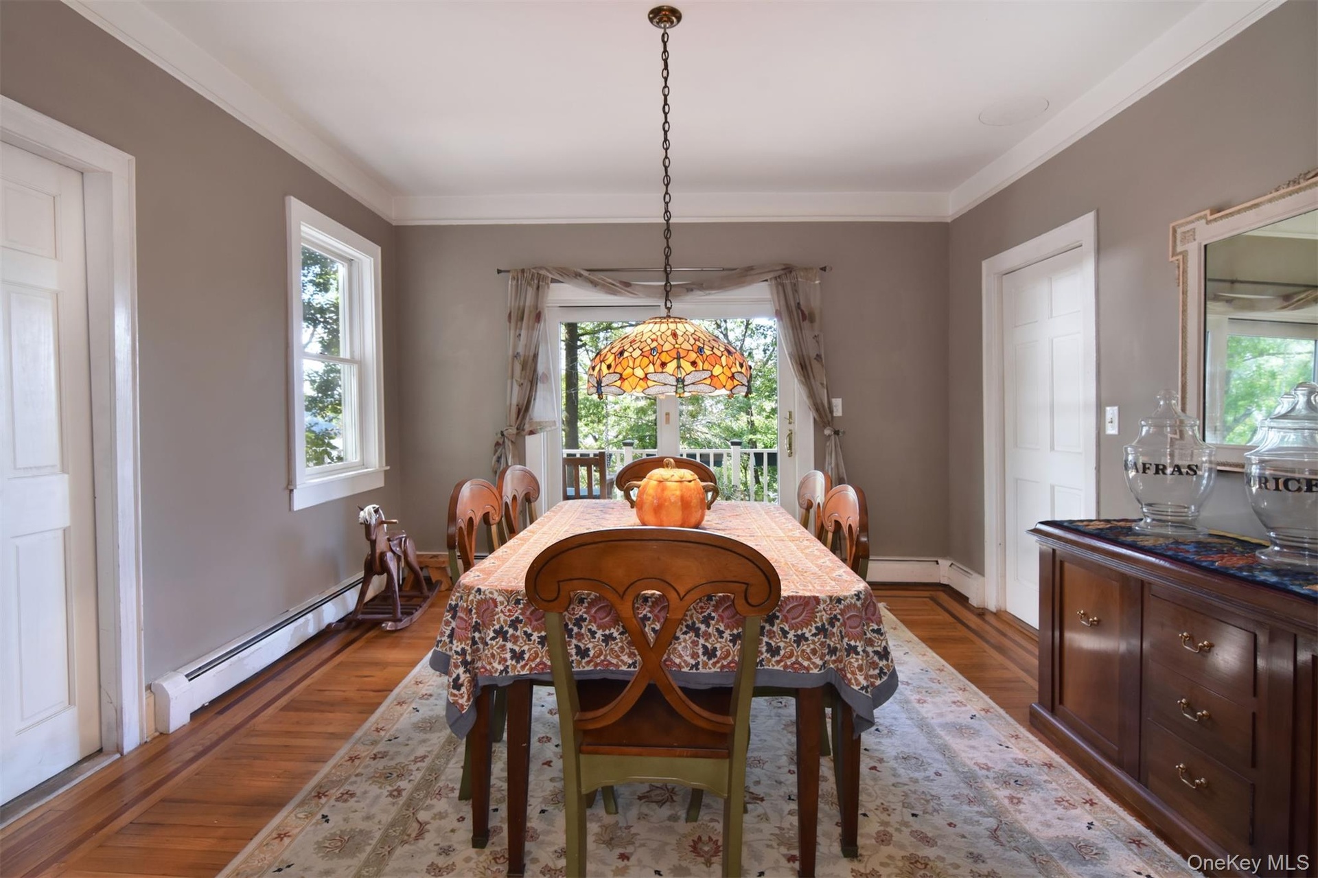 Formal dining room with large window to back yard.