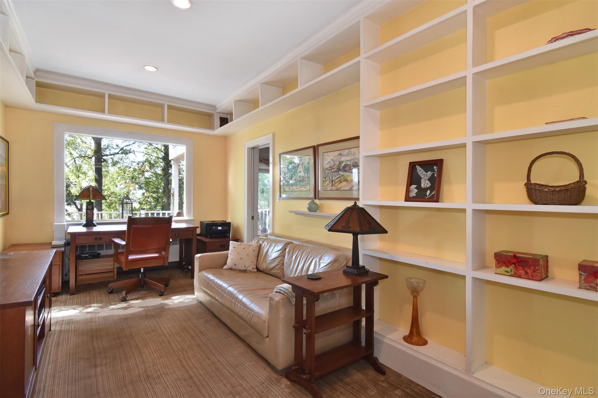 Den or office with built-in shelving.