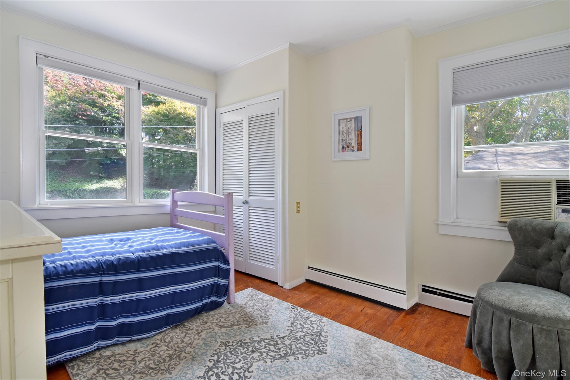 Sunny bedroom with closet