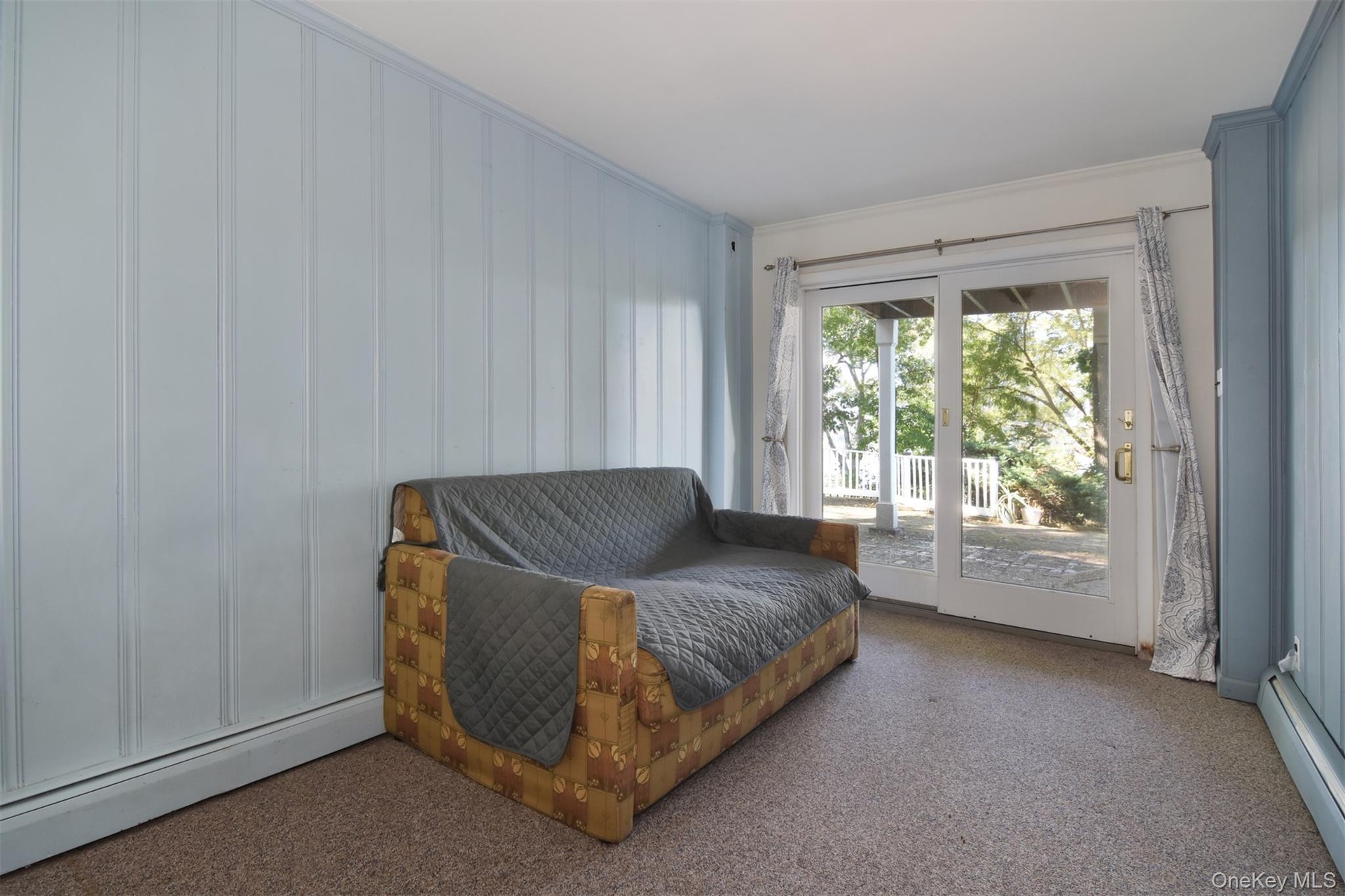 Second lower level bedroom with sliders to patio