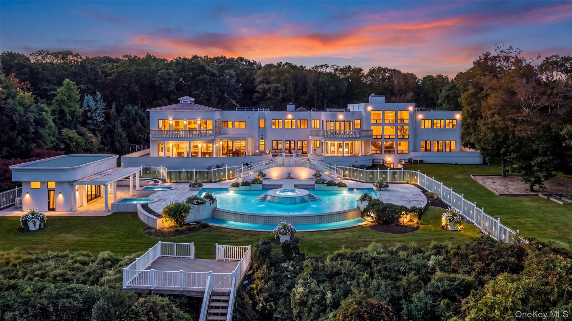 Estate aerial at twilight (virtually enhanced twilight/night rendering)