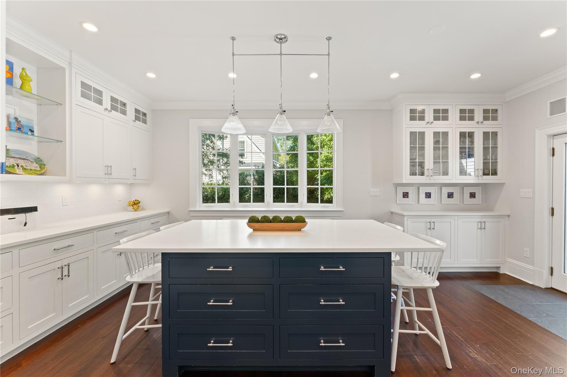 Charming kitchen eat-in area, complete with additional cabinetry and counter space, offers the perfect setting for casual dining