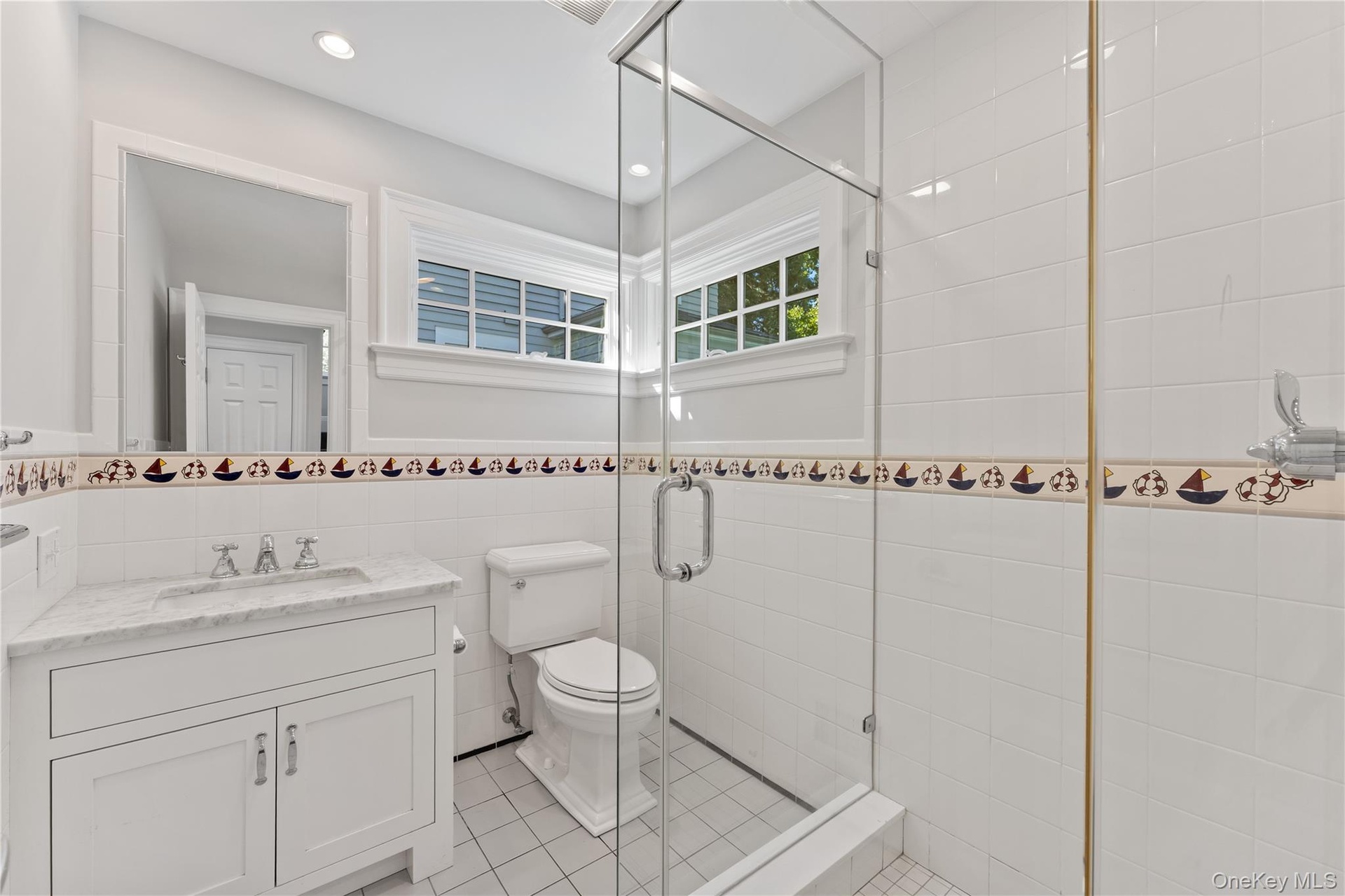 Full bathroom perfectly situated next to door with access to pool area for guest entertainment