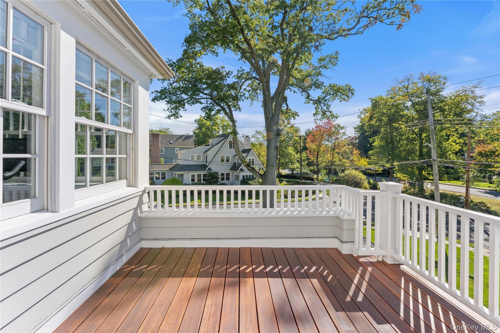 Primary bedroom has access to deck area for outdoor relaxation