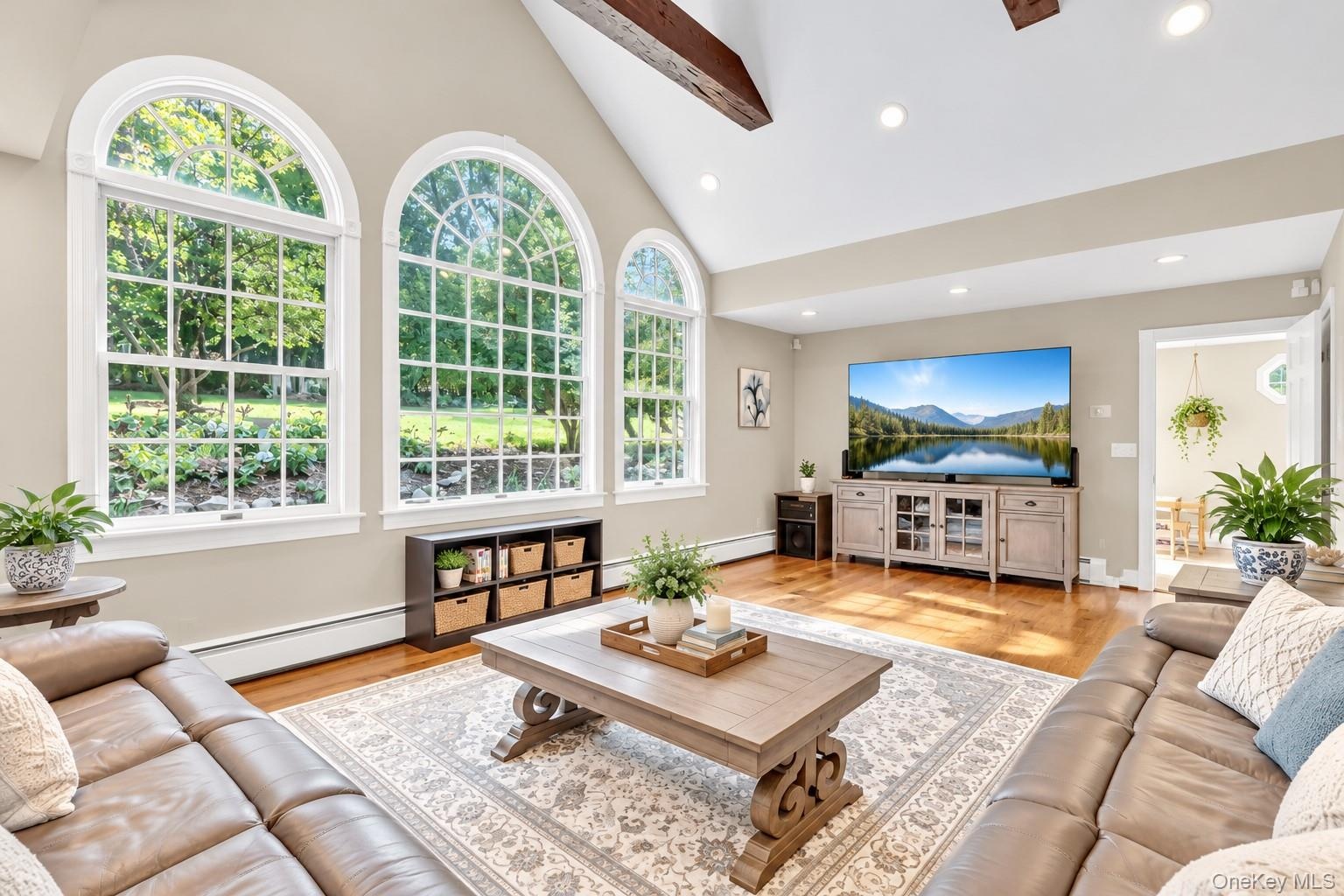 Magnificent Den With Vaulted Ceiling, Gleaming Hardwood Floors & Windows Overlooking Yard