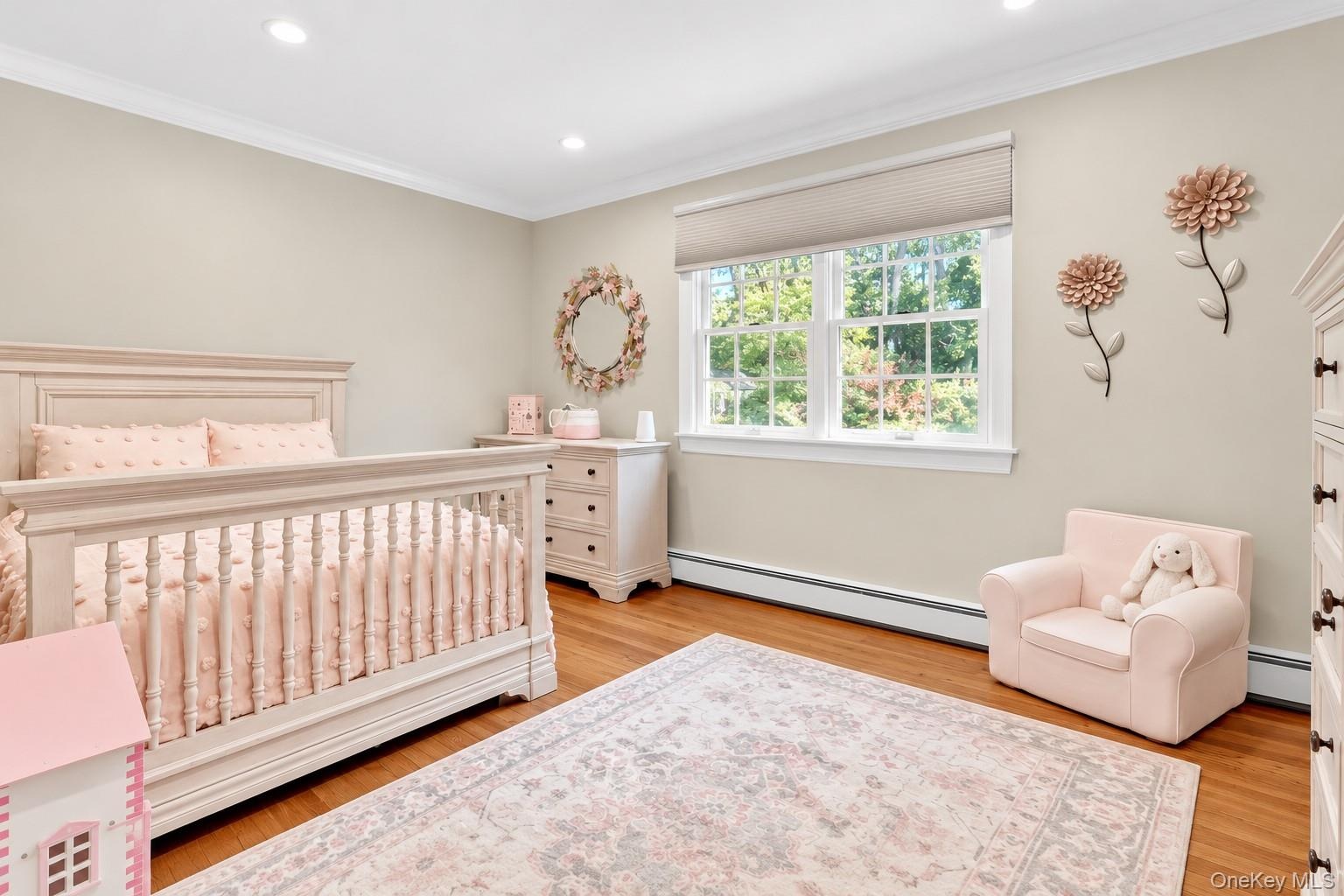 Bedroom #3 With Hardwood Floors & Windows Overlooking Backyard