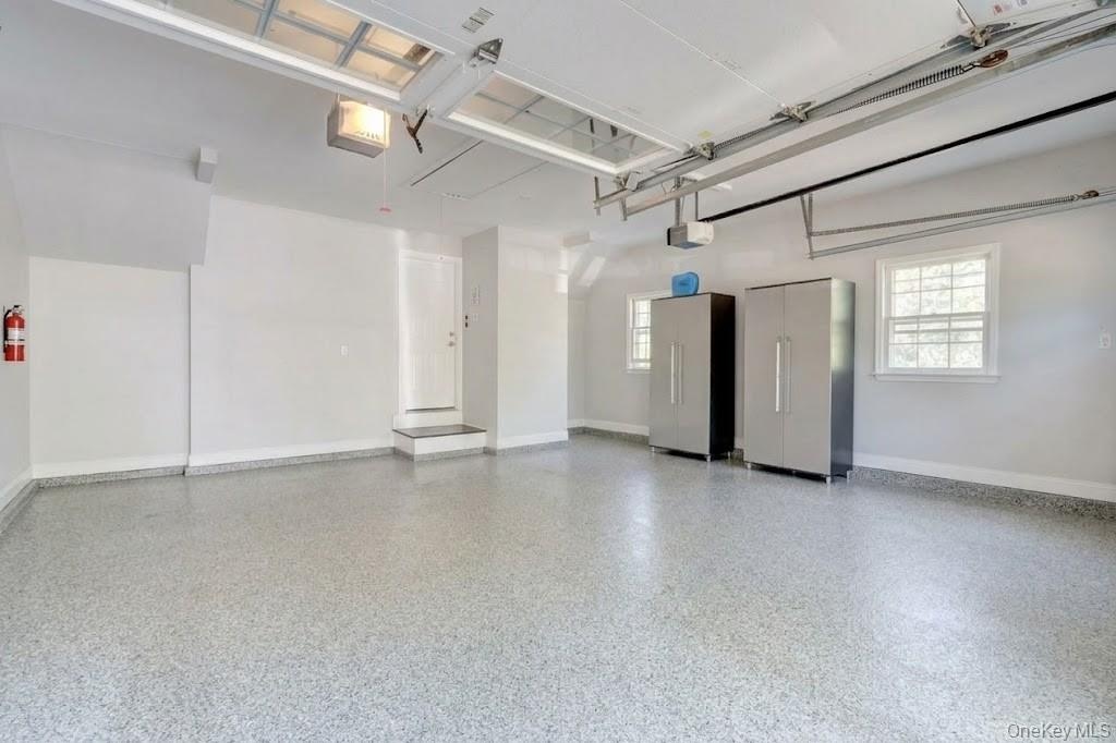 Two Car Garage With Epoxy Floor & New Garage Door Openers