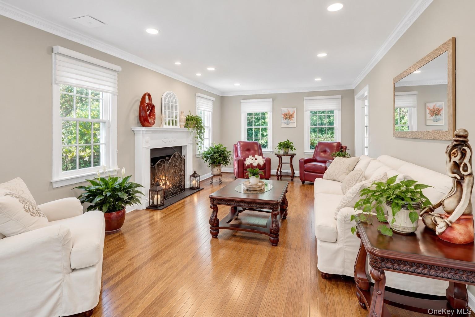Front to Back Living Room With Hardwood Floors & Fireplace