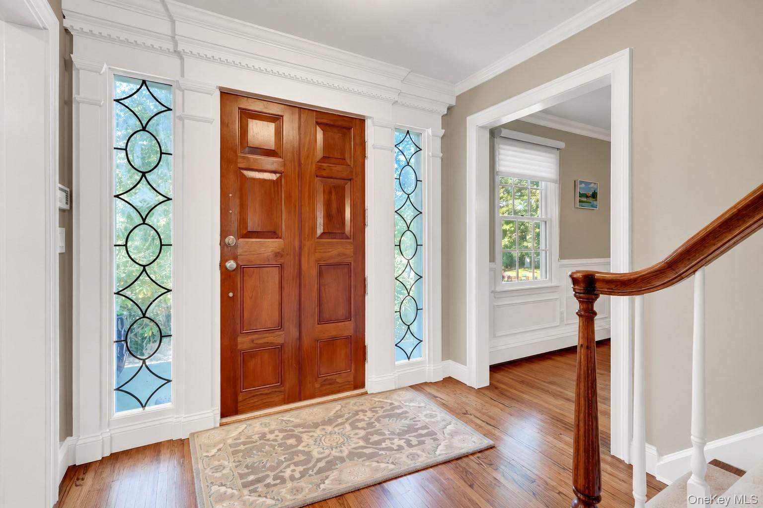Entry Foyer With Custom Door and Beautiful Leaded Glass Sidelights