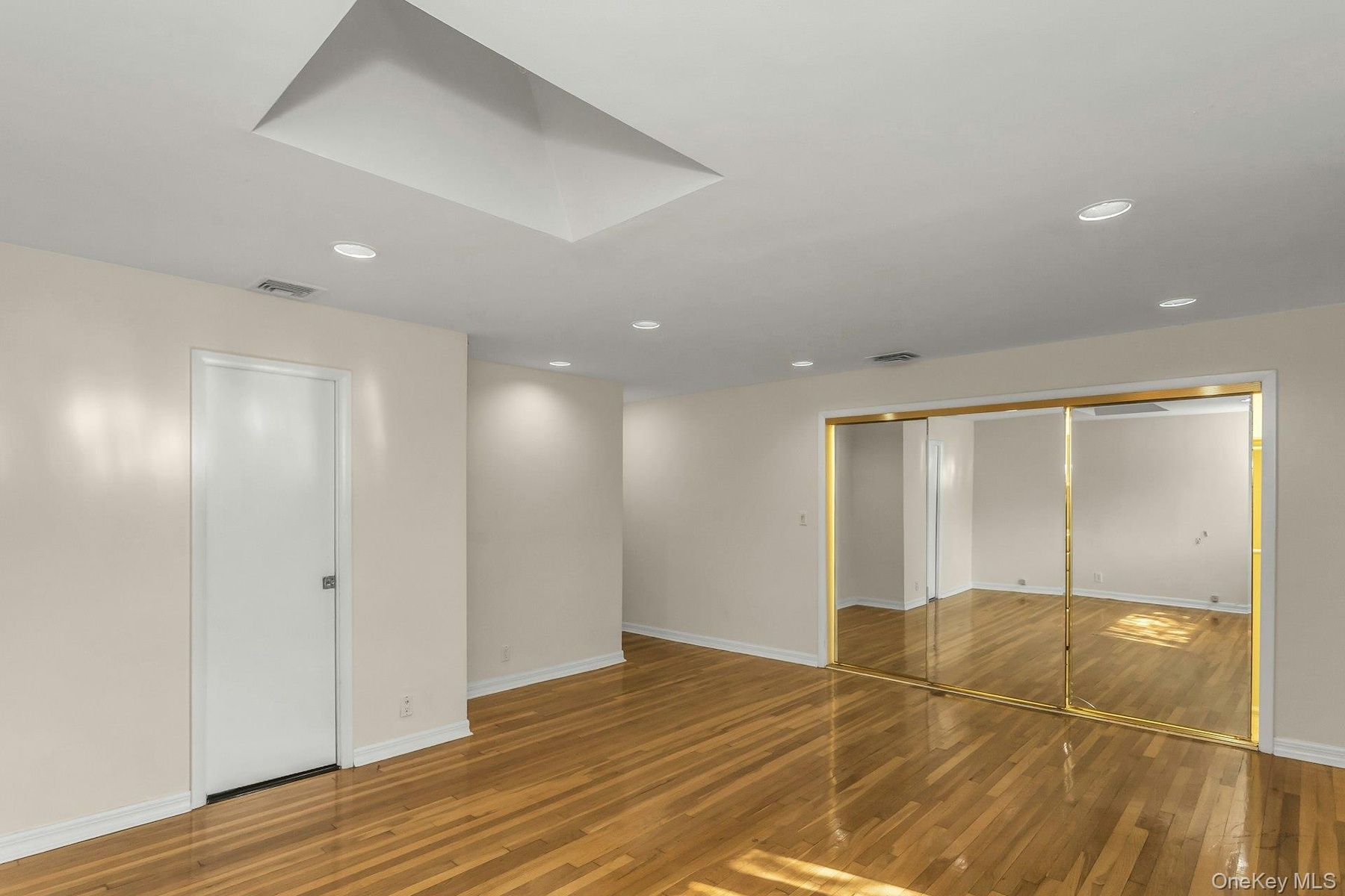Unfurnished bedroom featuring light wood-type flooring and recessed lighting