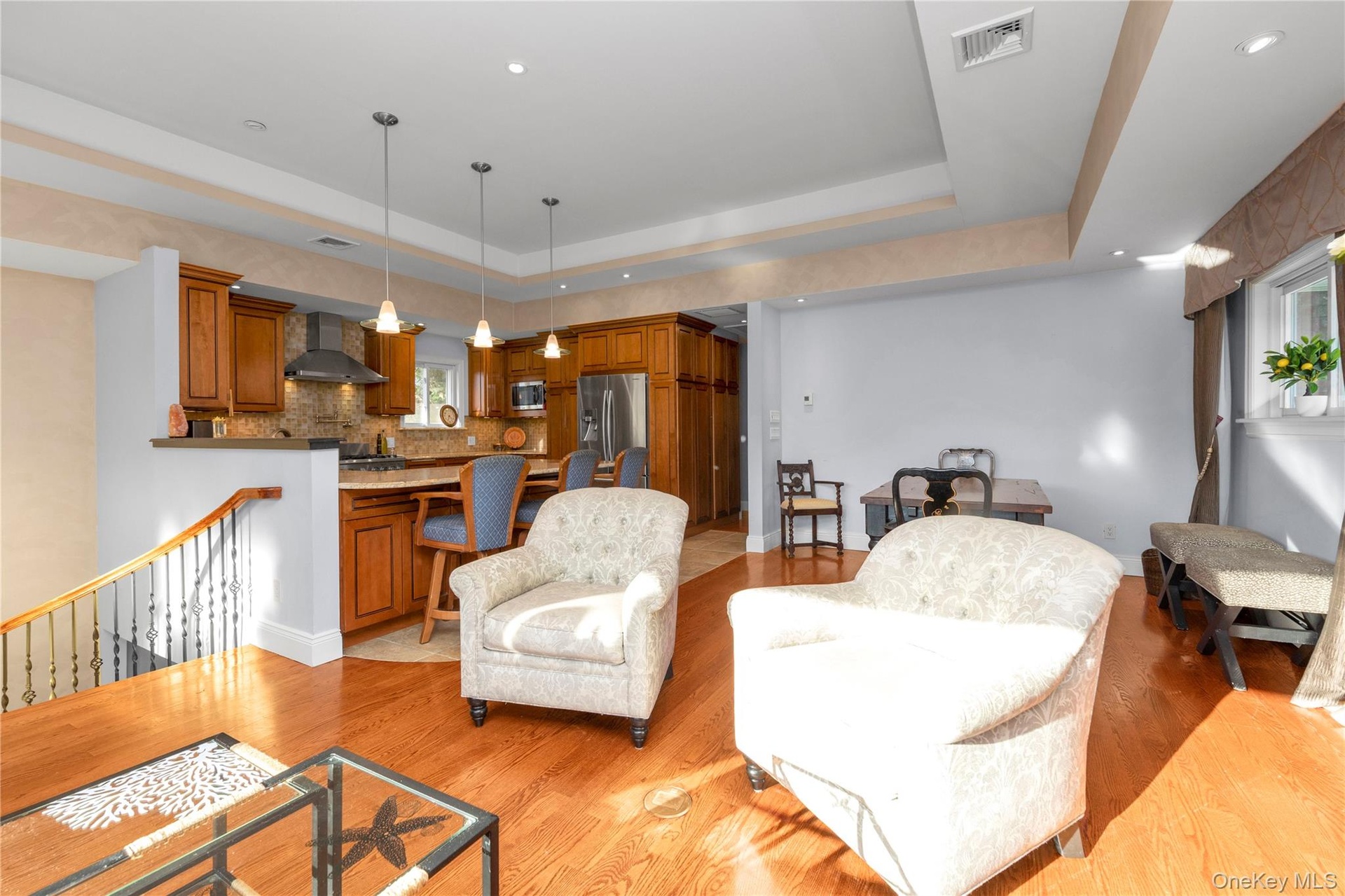 Front Living Room with open floorplan to Dining Room and Eat in Kitchen with Island