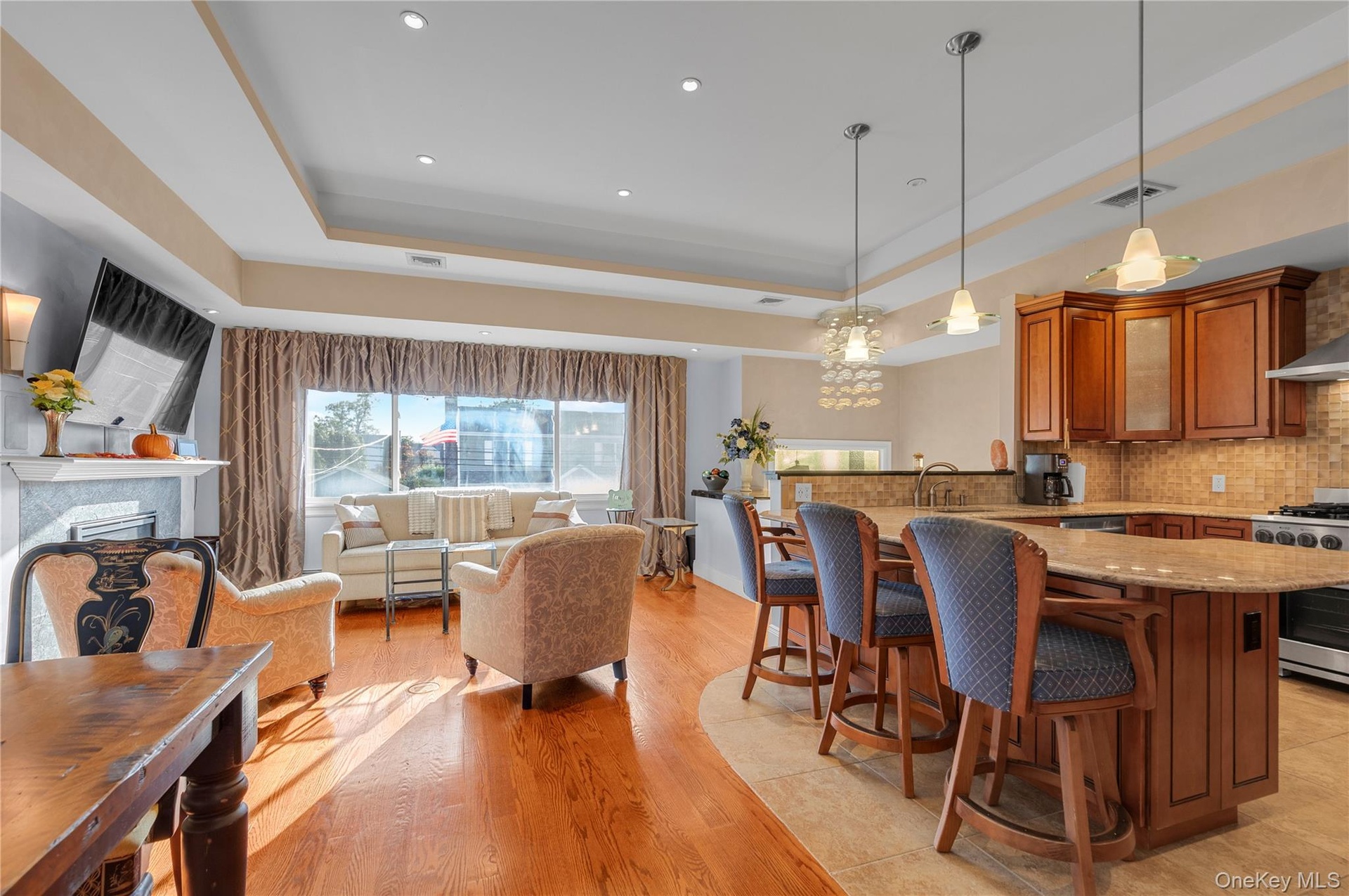 Living Room with open floorplan to Dining Room and Eat in Kitchen with Island