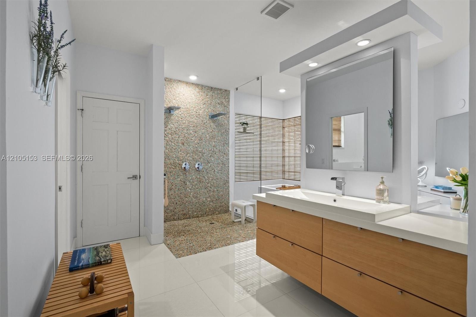 Dual vanity with a rectangular basin sink and a stone countertop