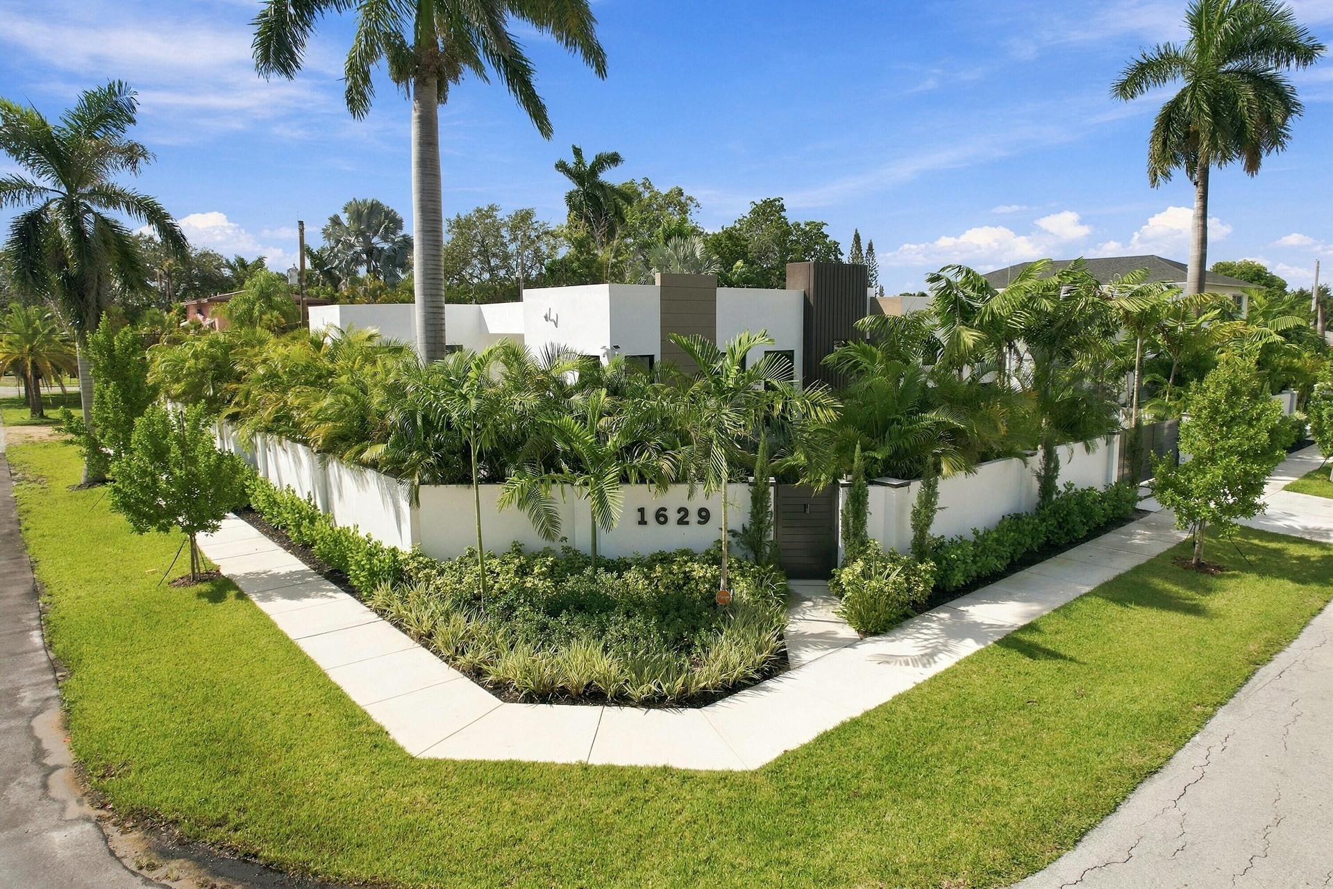 Modern residence featuring clean-lined architectural design with stucco exterior and dark accent detailing