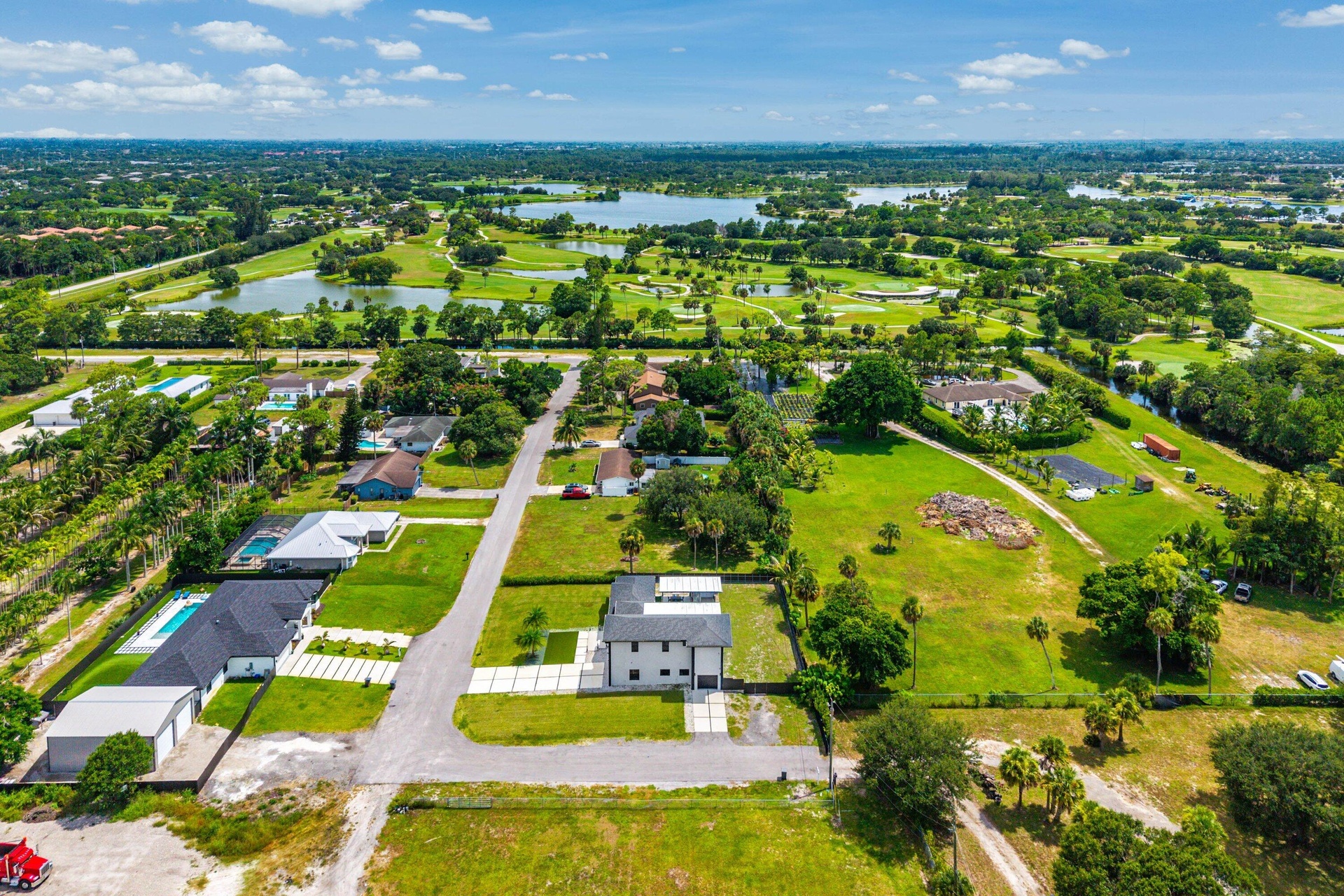 Expansive green spaces and water features surrounding the residential area