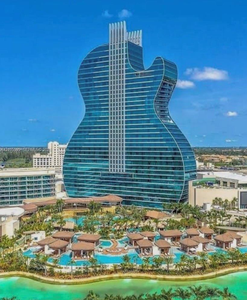 Unique guitar-shaped high-rise structure featuring a glass facade