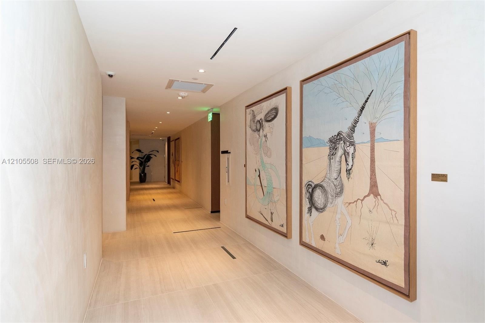 Recessed lighting, wood-finish flooring, and white walls