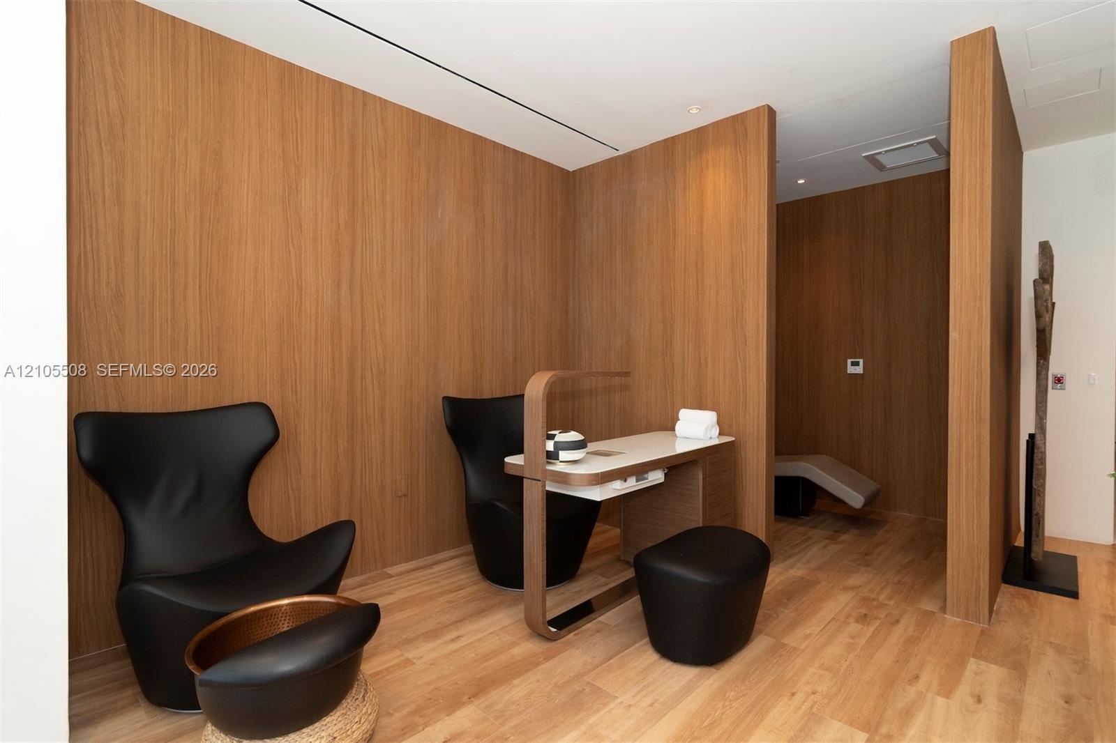 Wood-finish flooring with coordinating wood-paneled walls