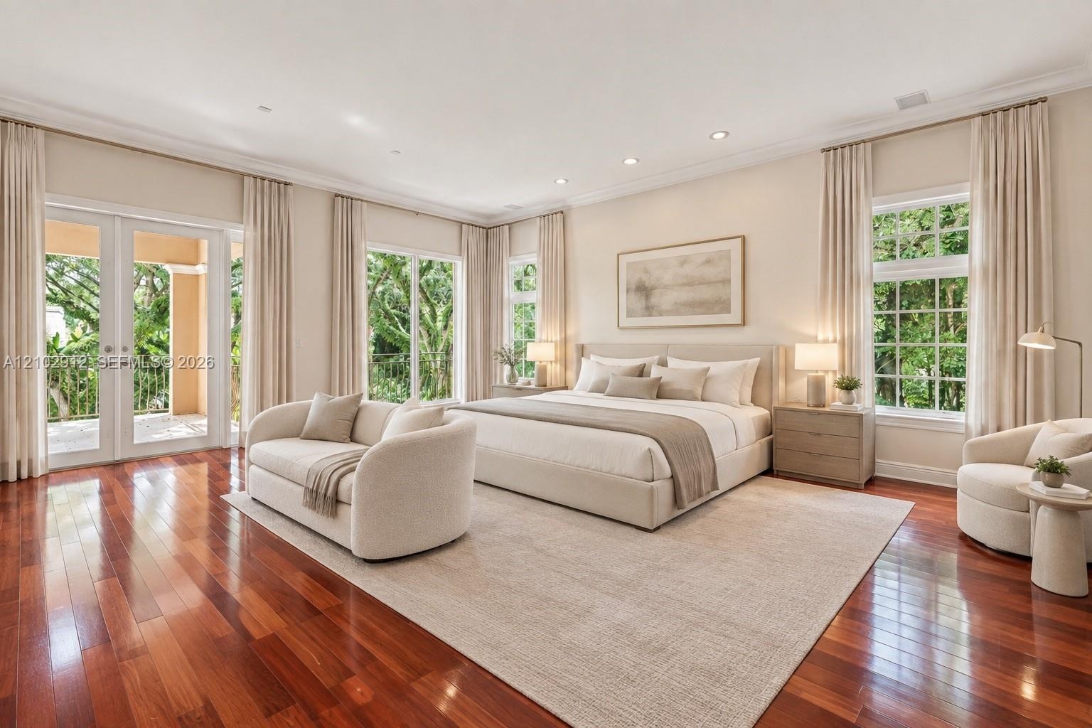 Rich wood-finish flooring with a large area rug