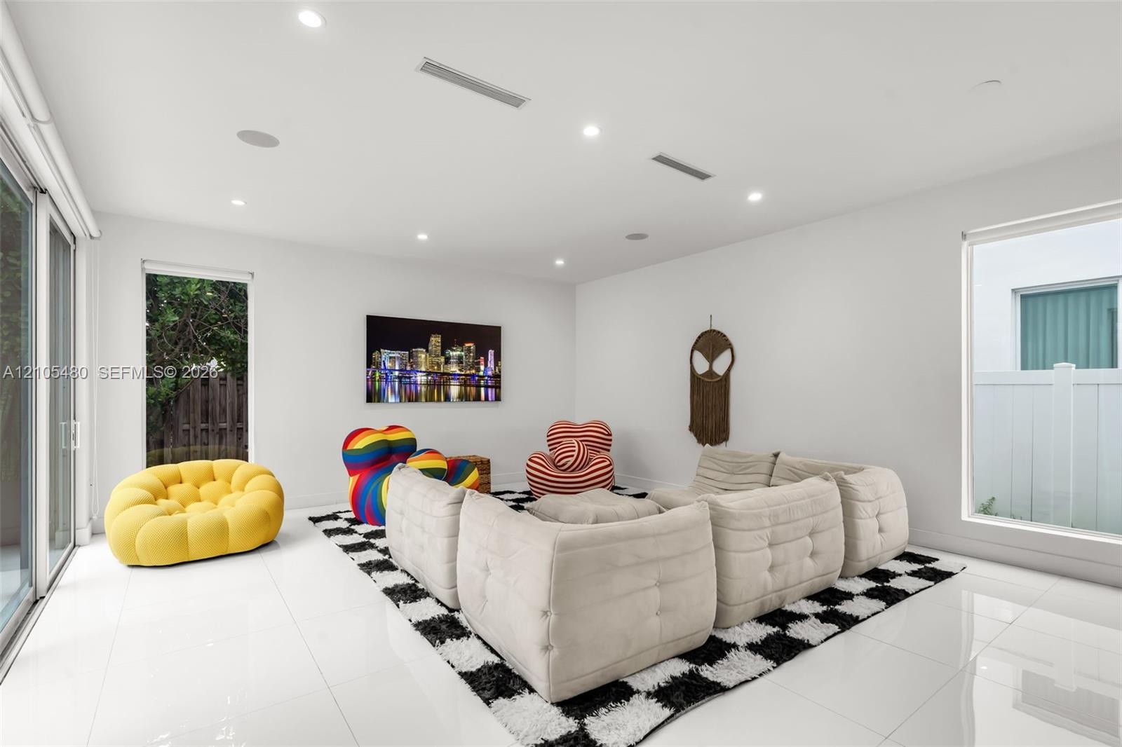 White tile flooring, recessed lighting, sliding glass door, and a large window