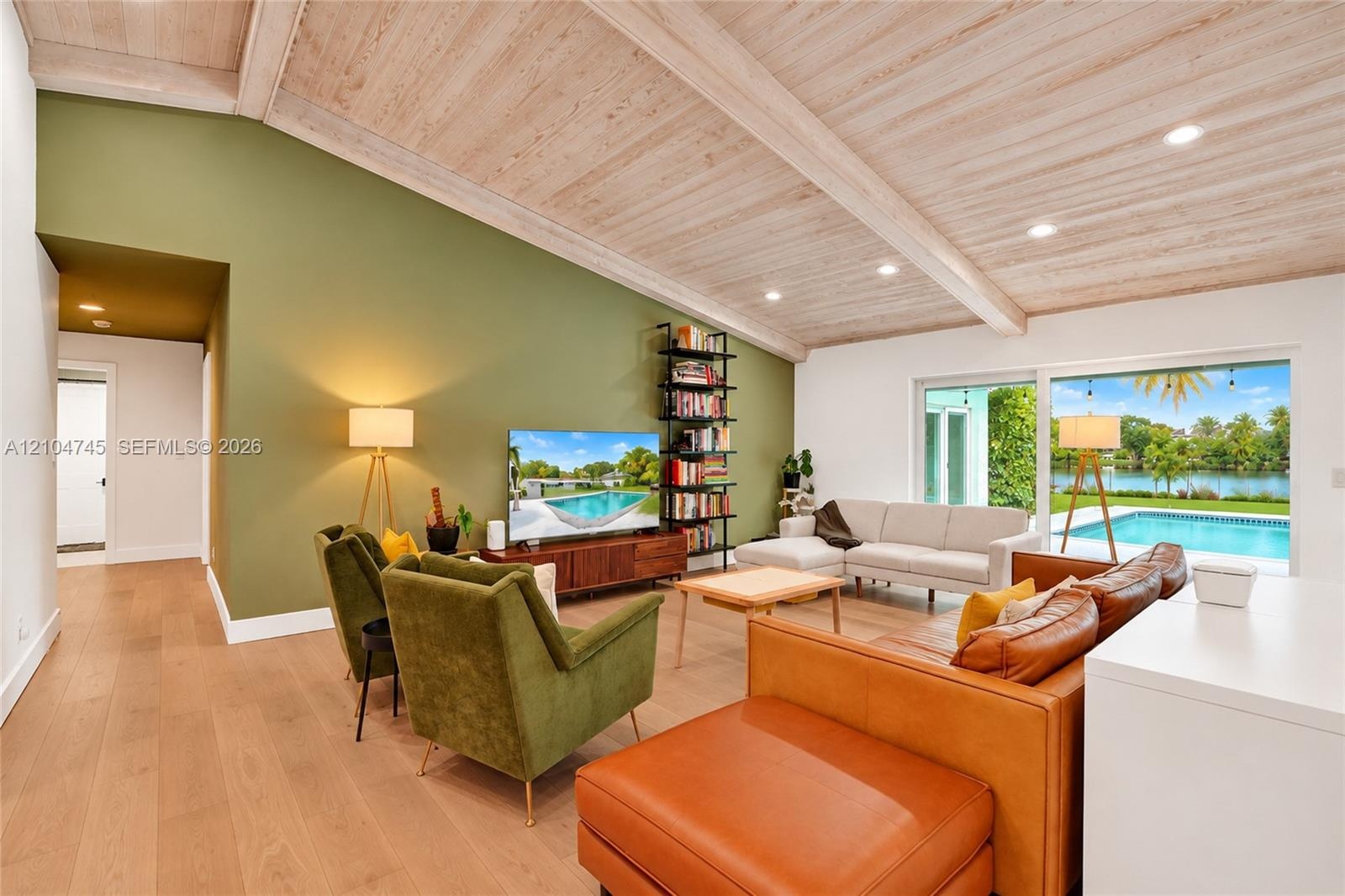 Vaulted wood-finish ceiling with exposed beams, wood-finish flooring, recessed lighting, and large sliding glass doors