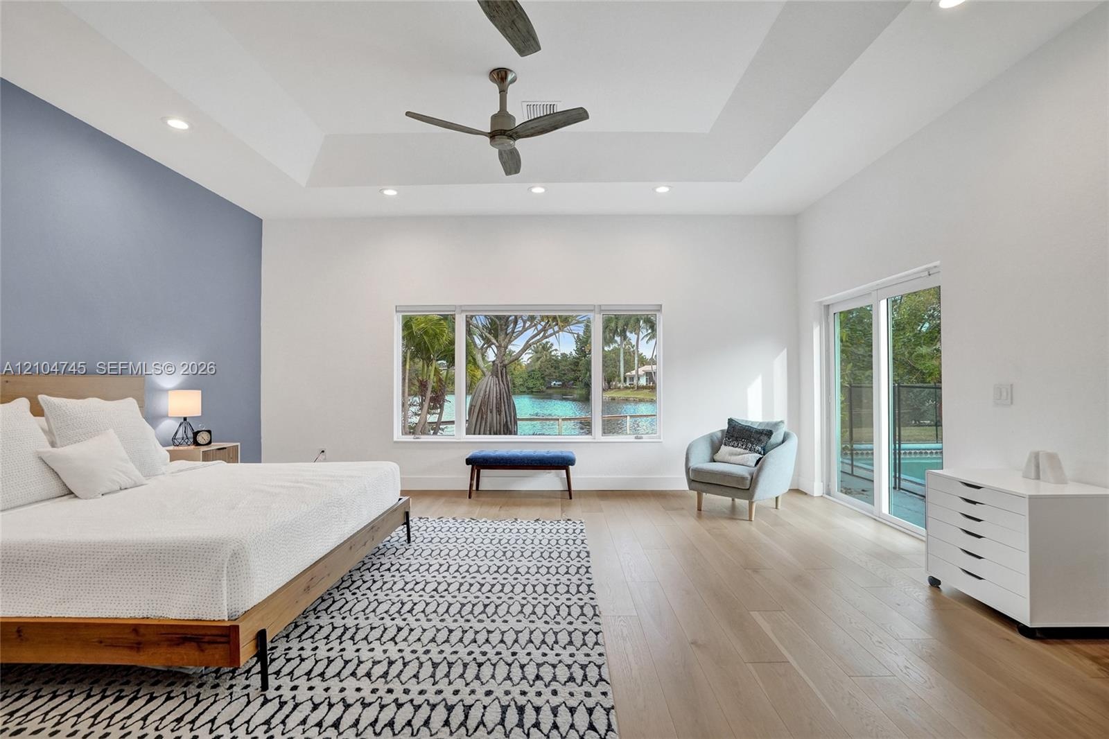 Tray ceiling with recessed lighting and a ceiling fan