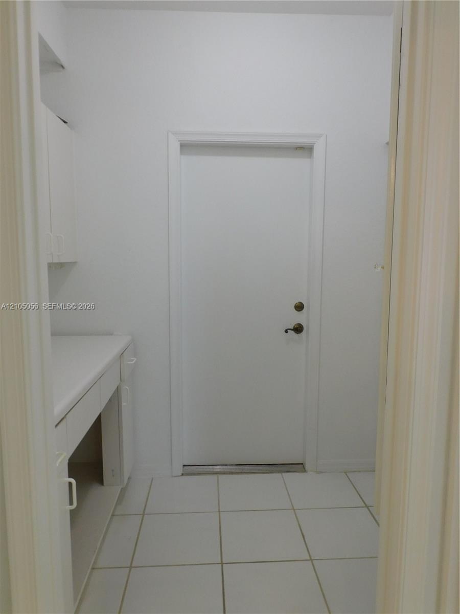 2nd Full Bathroom Upstairs - Dual vanity with integrated sinks, white cabinetry, and a large wall-mounted mirror