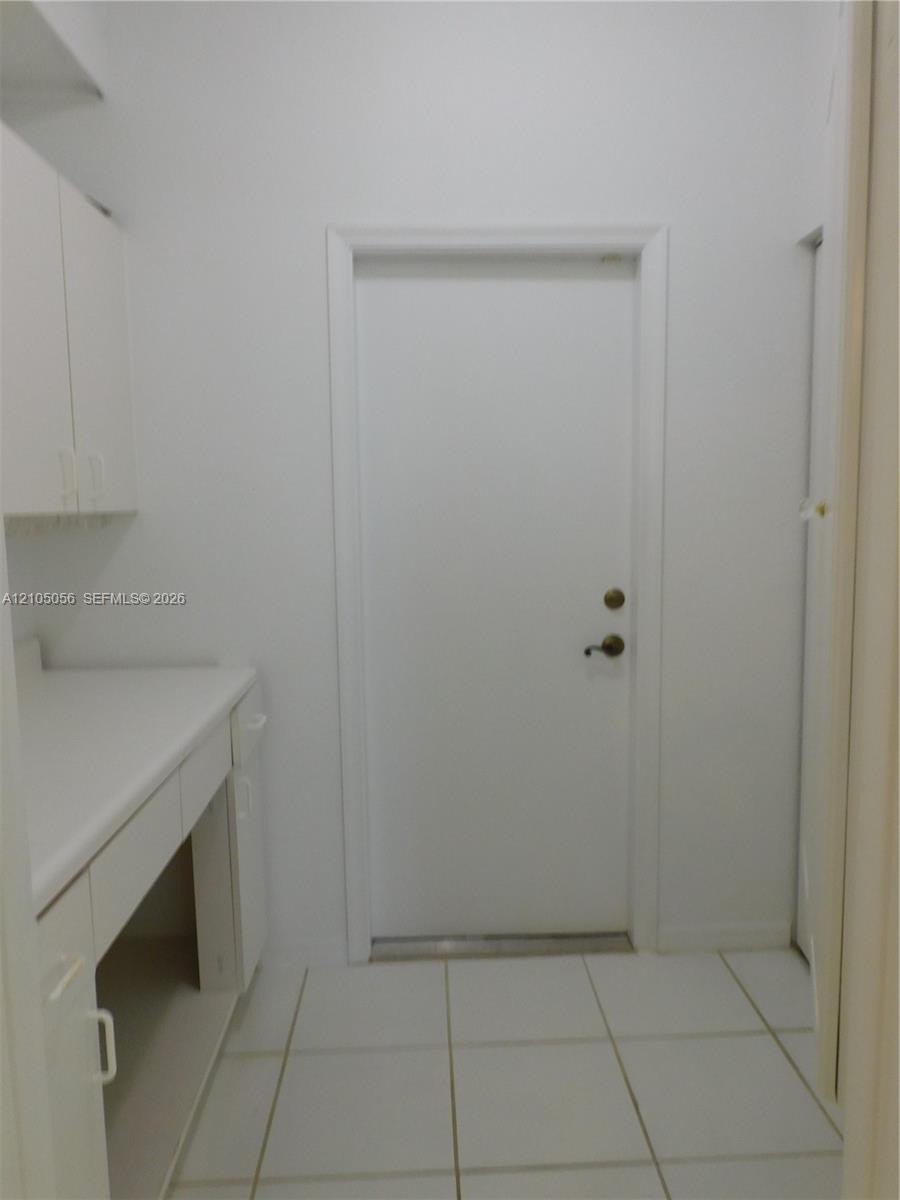 2nd Bathroom - ample countertop space, contemporary wall-mounted light fixtures, and mirrored medicine cabinets
