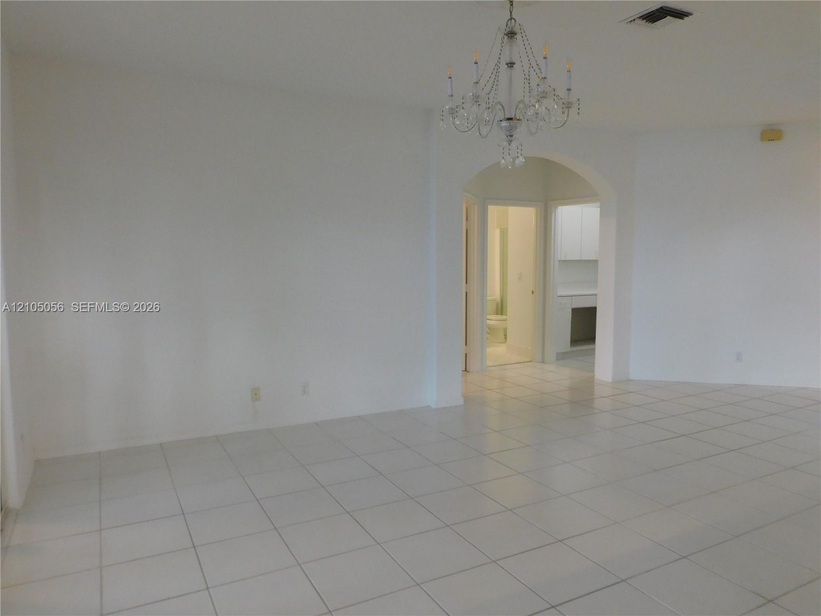 Family room view to kitchen snack counter and breakfast area - bringing everybody together + a view to the lake.