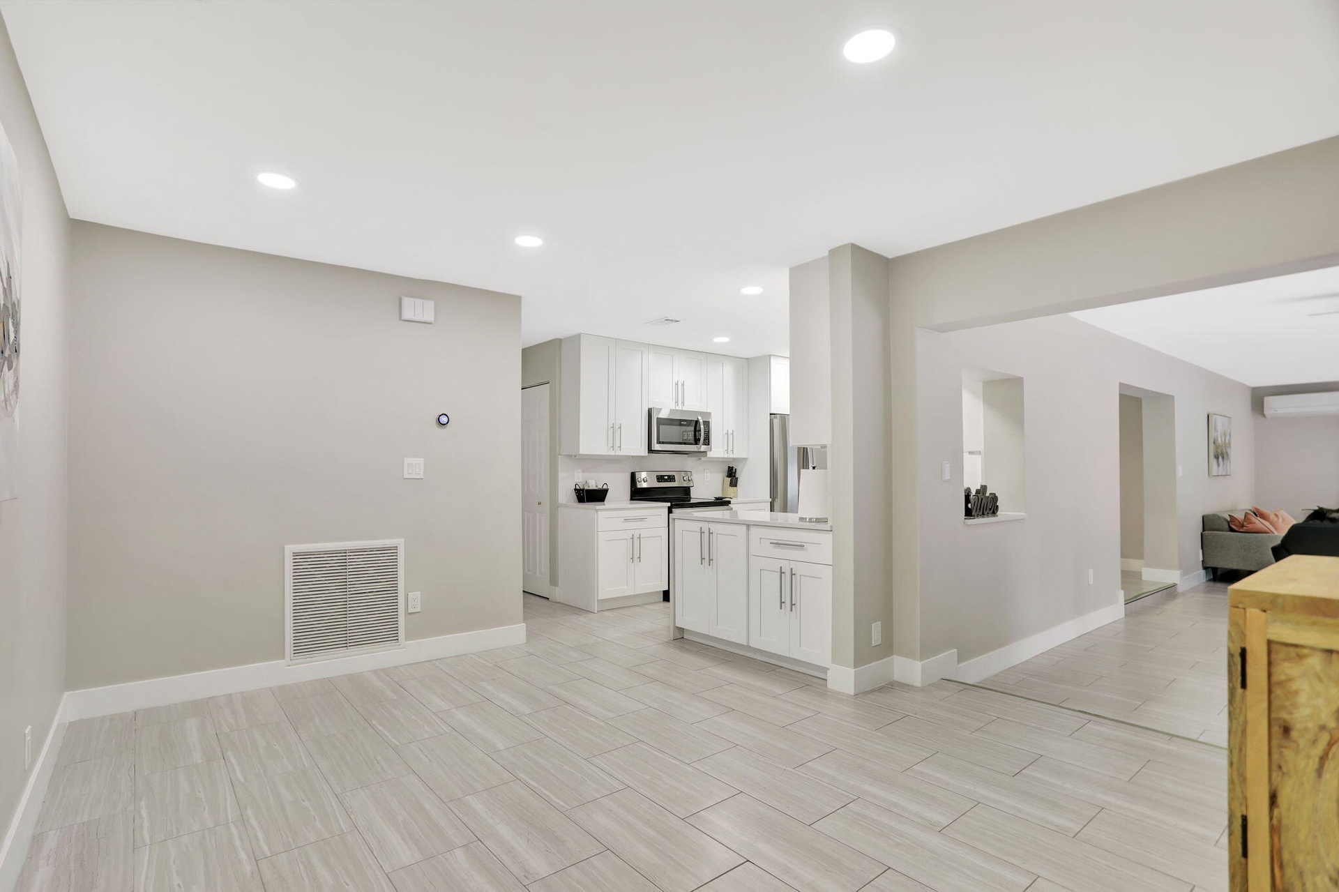 Versatile flex space off the kitchen—ideal for a home office, reading area or additional gathering space