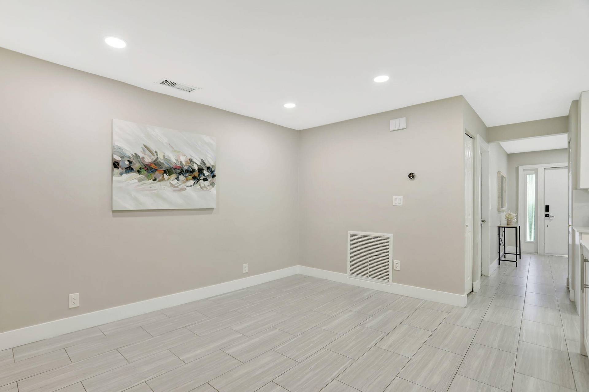Versatile flex space off the kitchen—ideal for a home office, reading area or additional gathering space