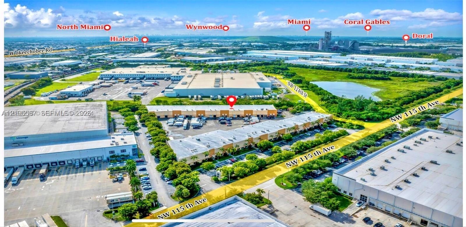 Aerial view of multiple industrial buildings, including a large warehouse structure and a complex of smaller commercial units