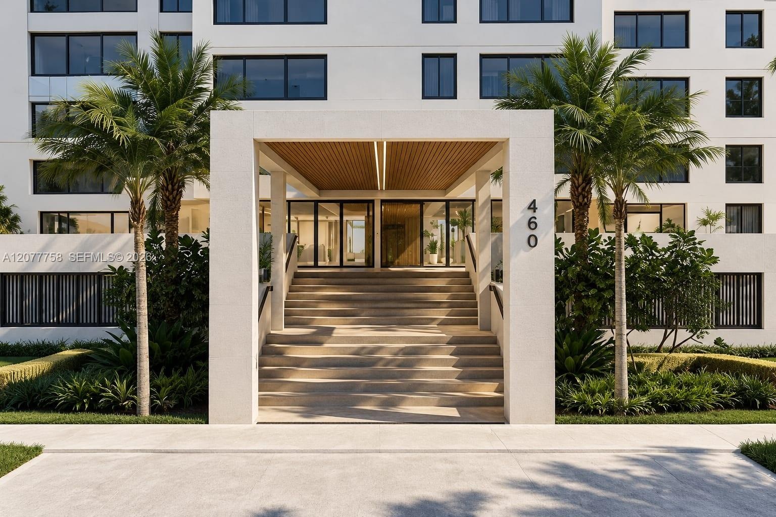 Modern building exterior with a framed entryway and grand staircase