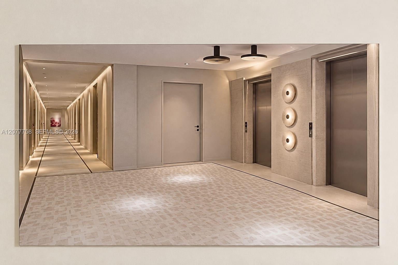Hallway with integrated ceiling lighting, recessed wall lighting, and two stainless steel elevators