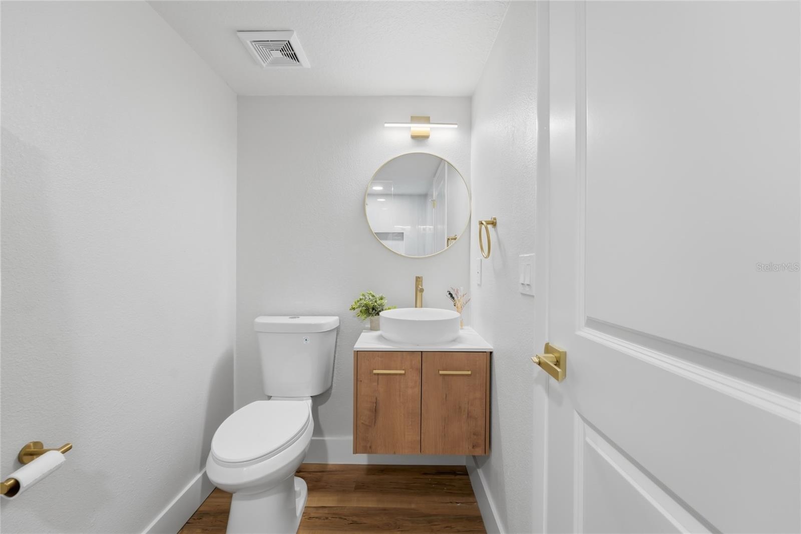 1st floor bathroom featuring a Floating vanity along with upgraded accessories