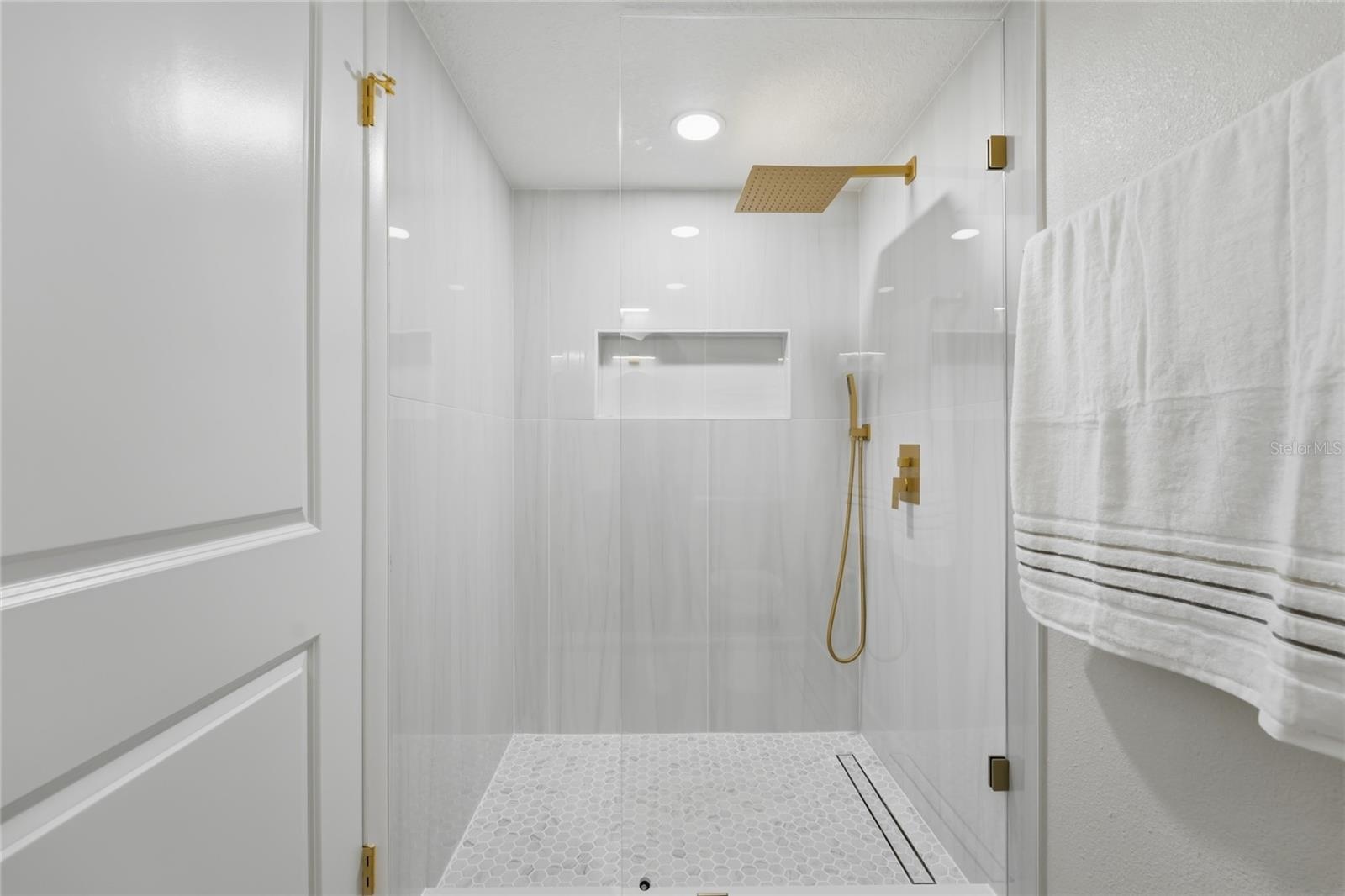 1st Floor bathroom feautring a stunning porcelain-tiled walk-in shower