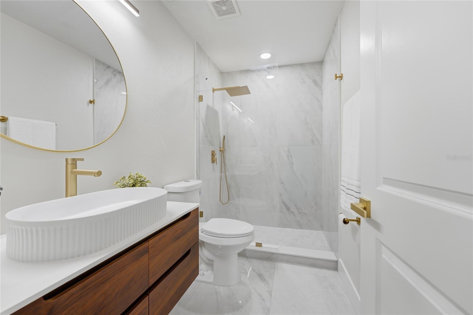 2nd Floor Bathroom including a beautiful oval floating vanity