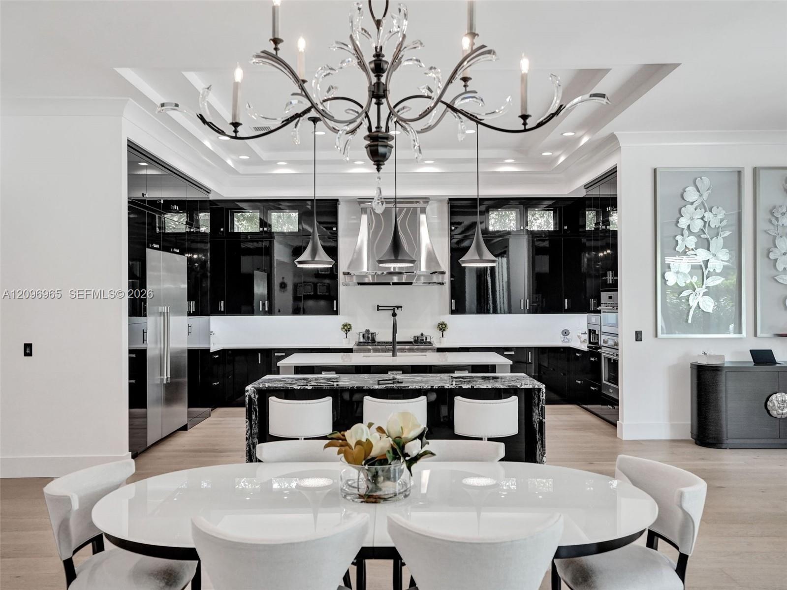 Floor-to-ceiling accent wall featuring textured white tiling, integrated linear fireplace, and custom black built-in shelving