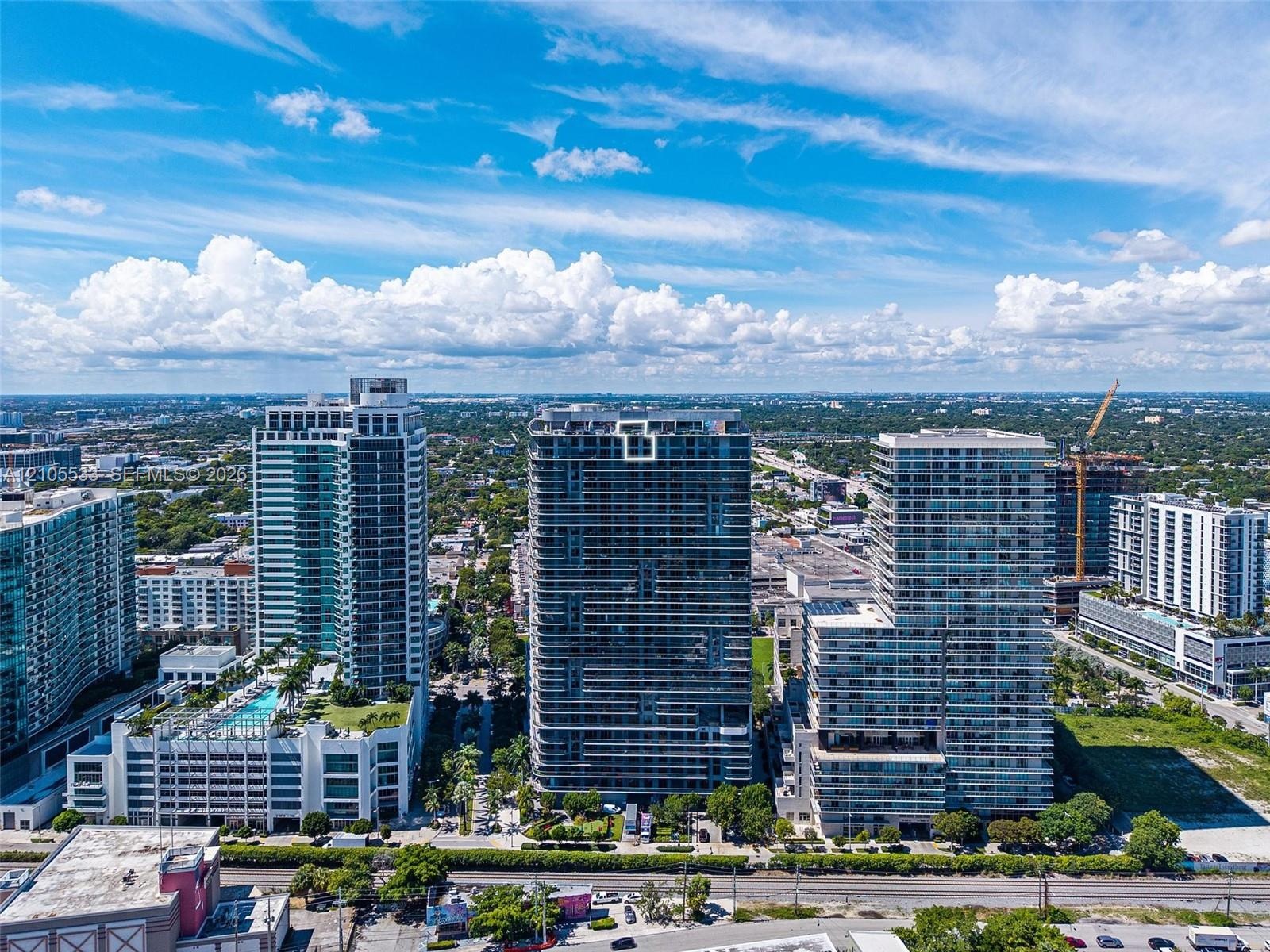 High-rise residential towers featuring glass facades and private balconies