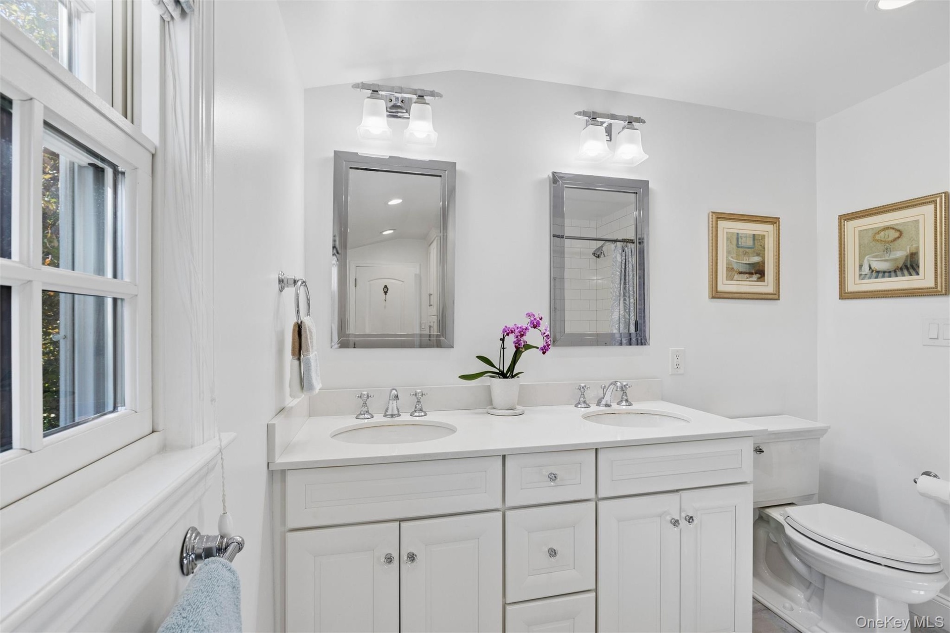 With dual sinks and a shower/tub