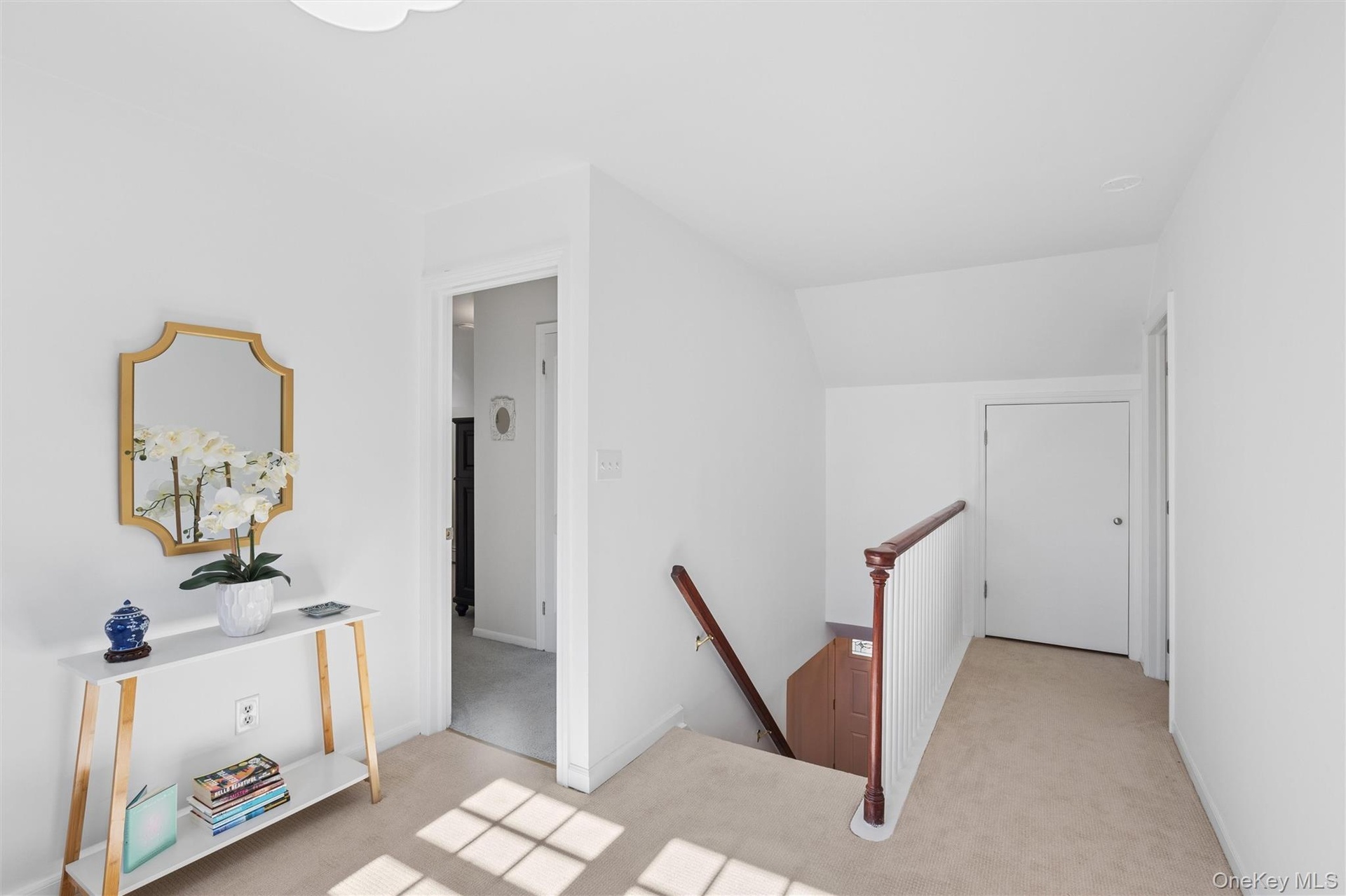 Generous upstairs landing with extra storage space in the extended eaves over the front porch